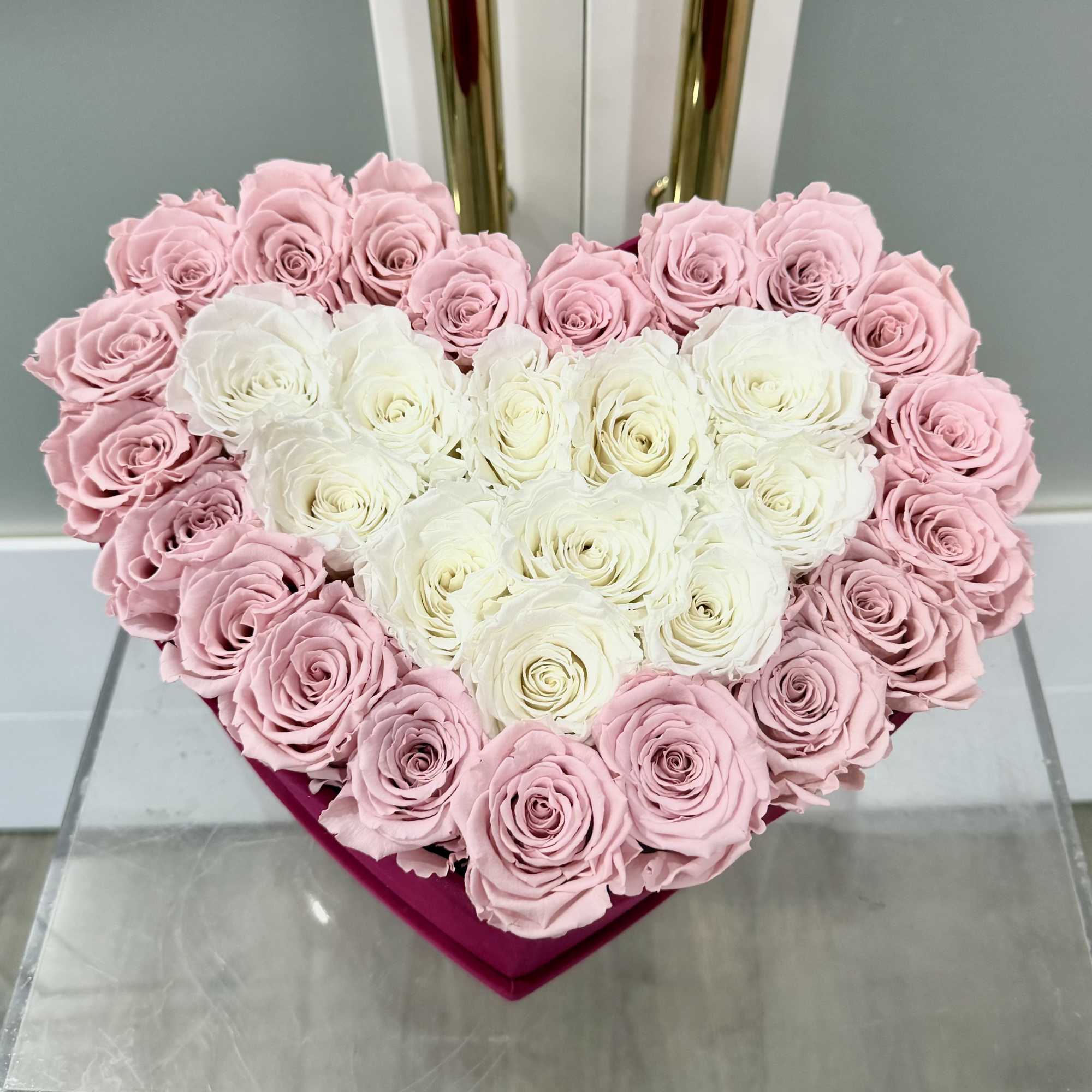 Express your deepest emotions with this breathtaking arrangement of 31 preserved pink