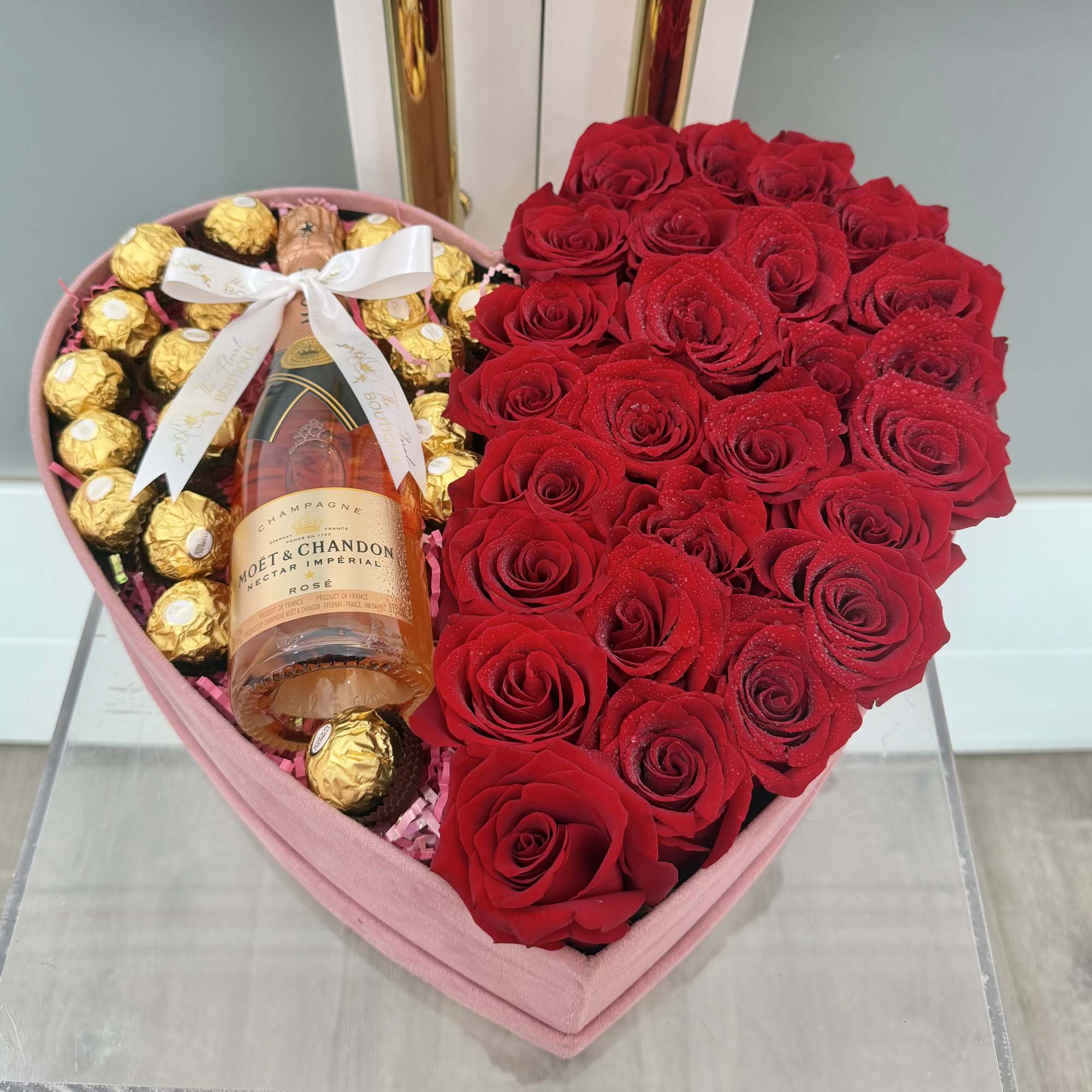 A romantic gesture that speaks volumes. Our elegant heart-shaped box is filled