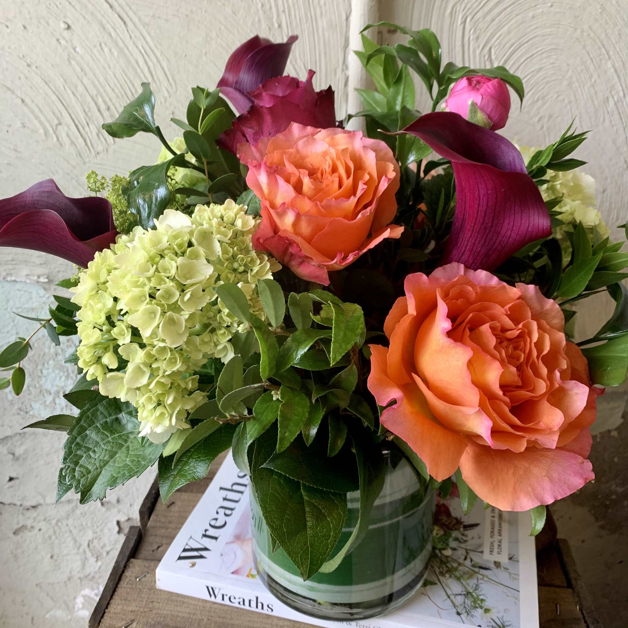 Smiles will be blooming everywhere this attractive garden arrangement goes! Featuring bright