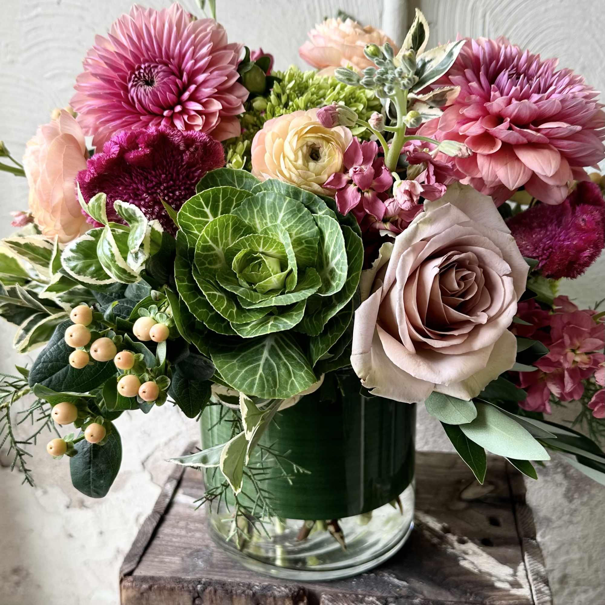 Chic feminine Fall tones of seasonal florals that showcase dahlias, ranunculus, celosia