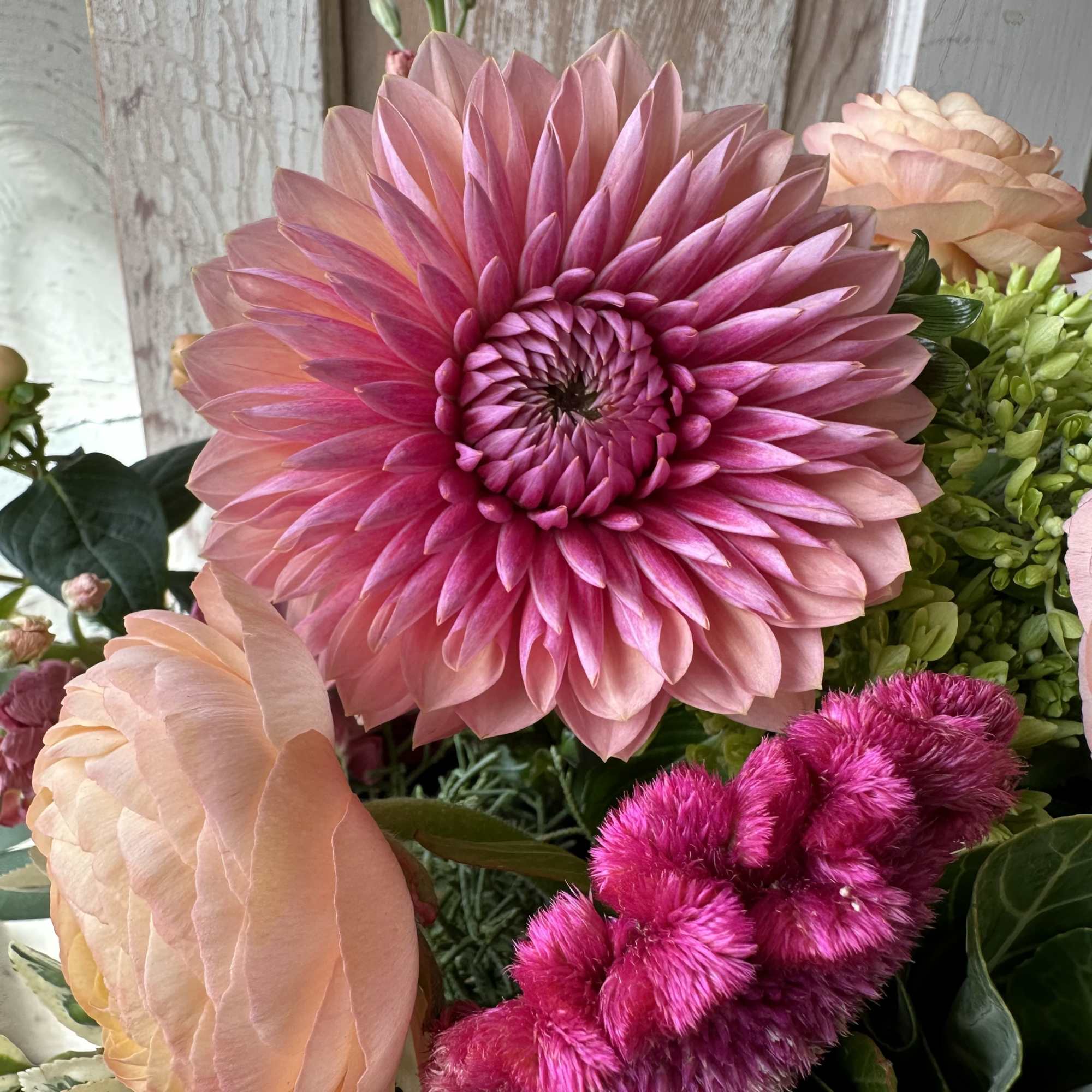 Chic feminine Fall tones of seasonal florals that showcase dahlias, ranunculus, celosia