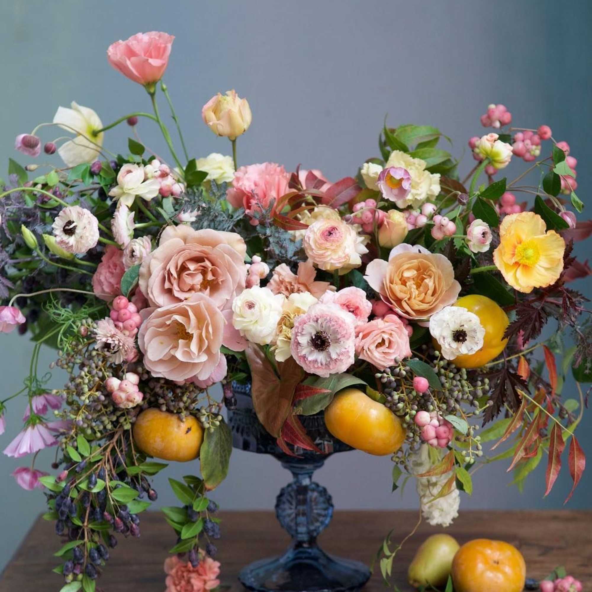 Presenting an exquisite floral centerpiece designed for a gala event, perfect for