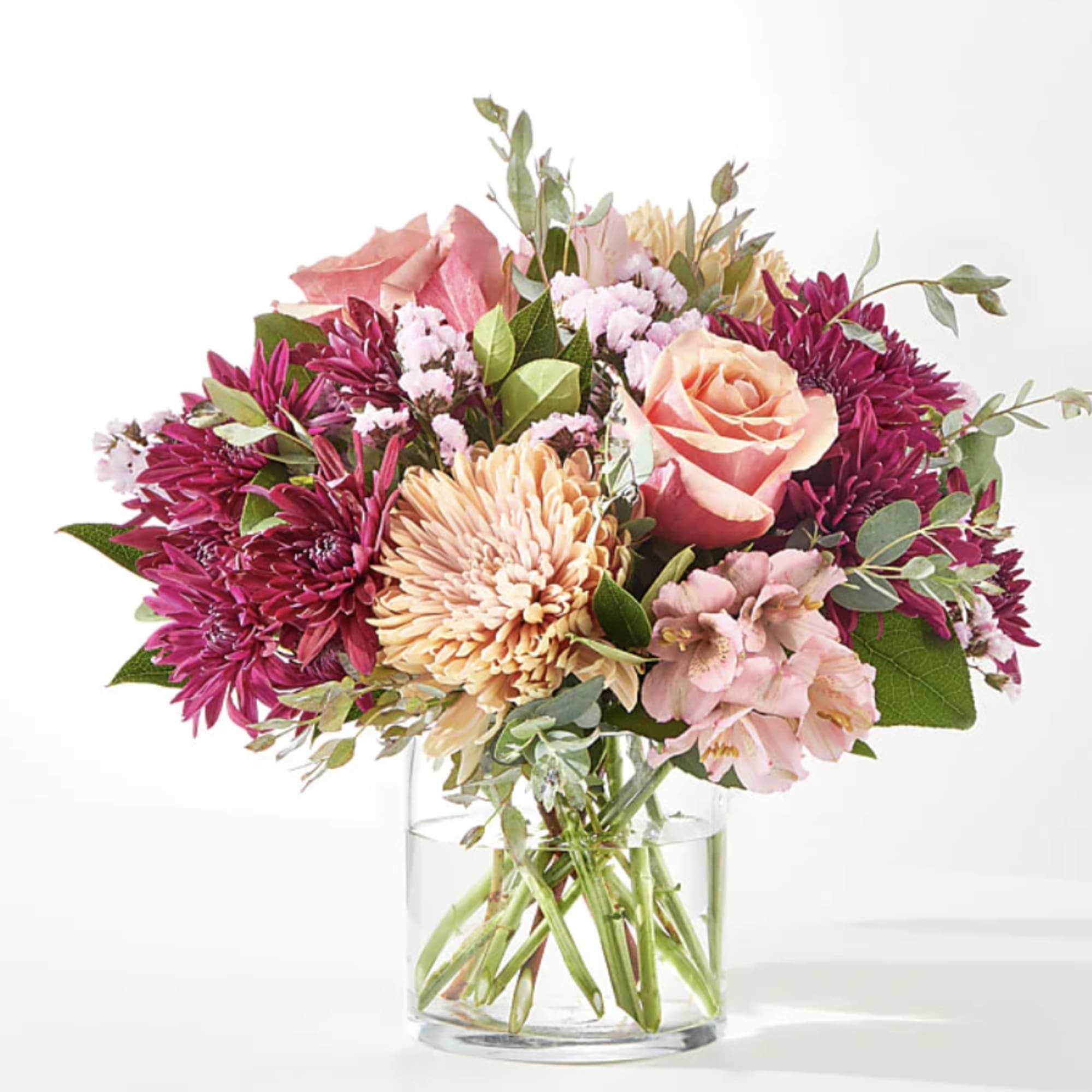A delectable blend of berry shades make this a beautiful arrangement to A delectable blend of berry shades make this a beautiful arrangement to