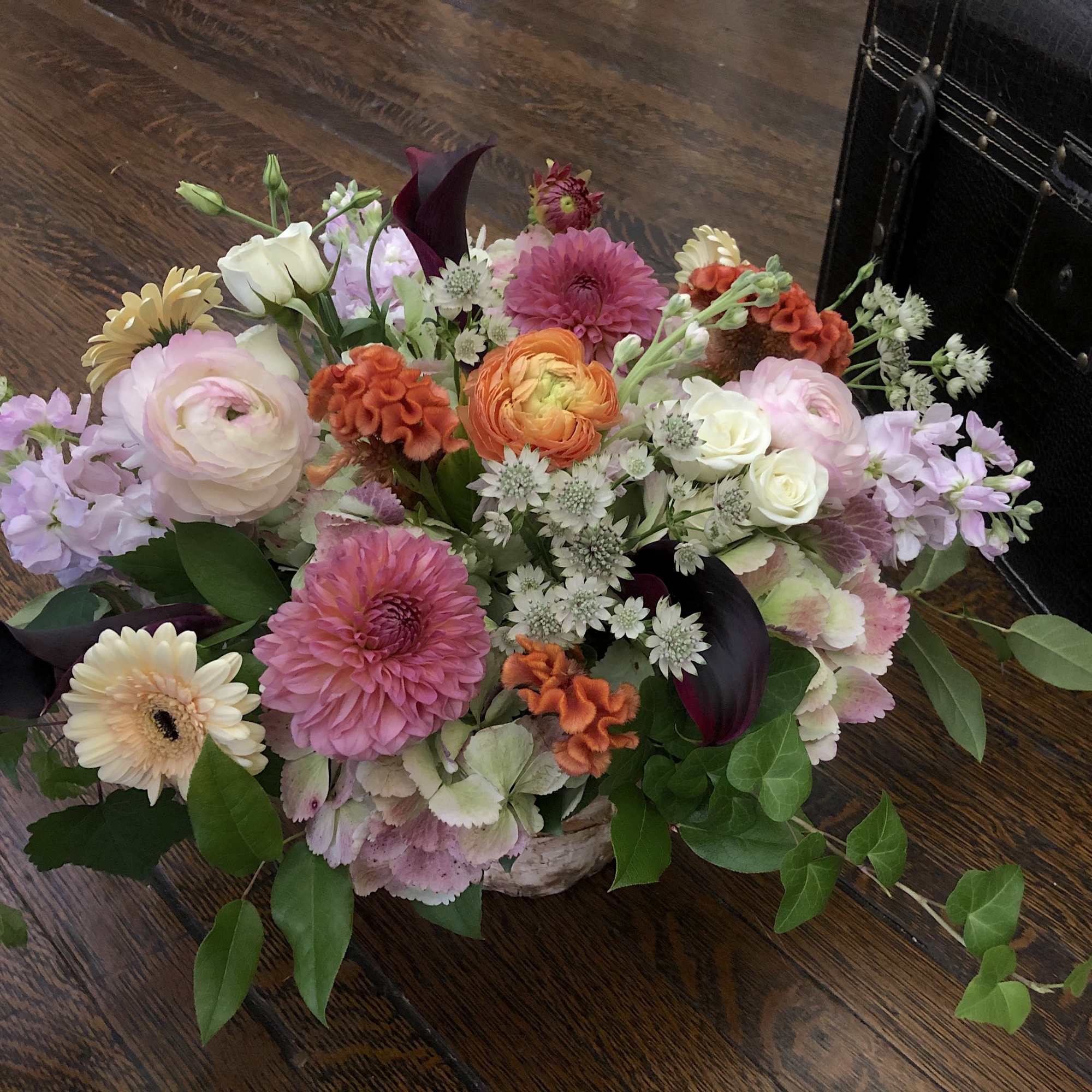 A collection of late summer and early fall blossoms in hues of A collection of late summer and early fall blossoms in hues of