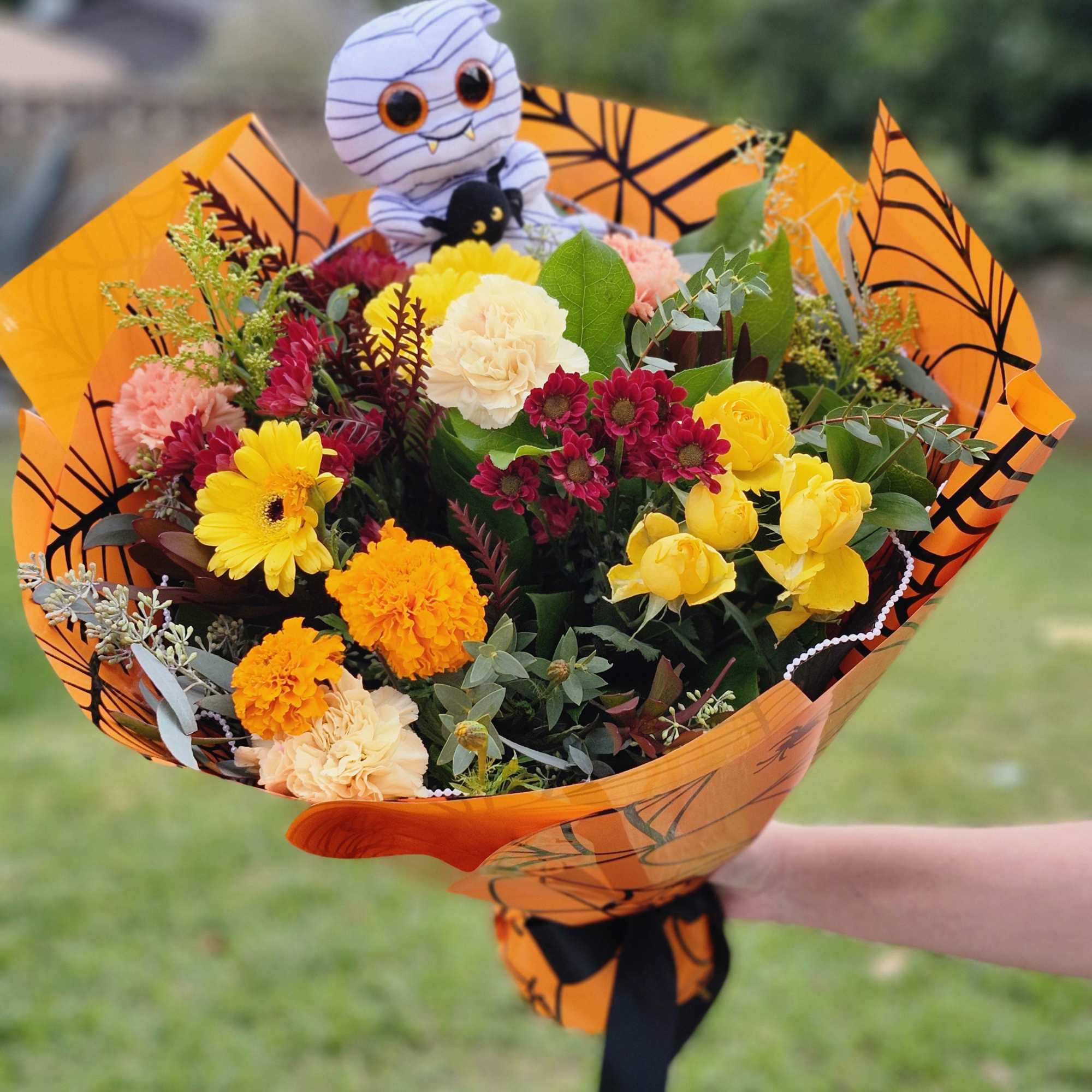 Designer's Choice fall flowers with Halloween theme paper
