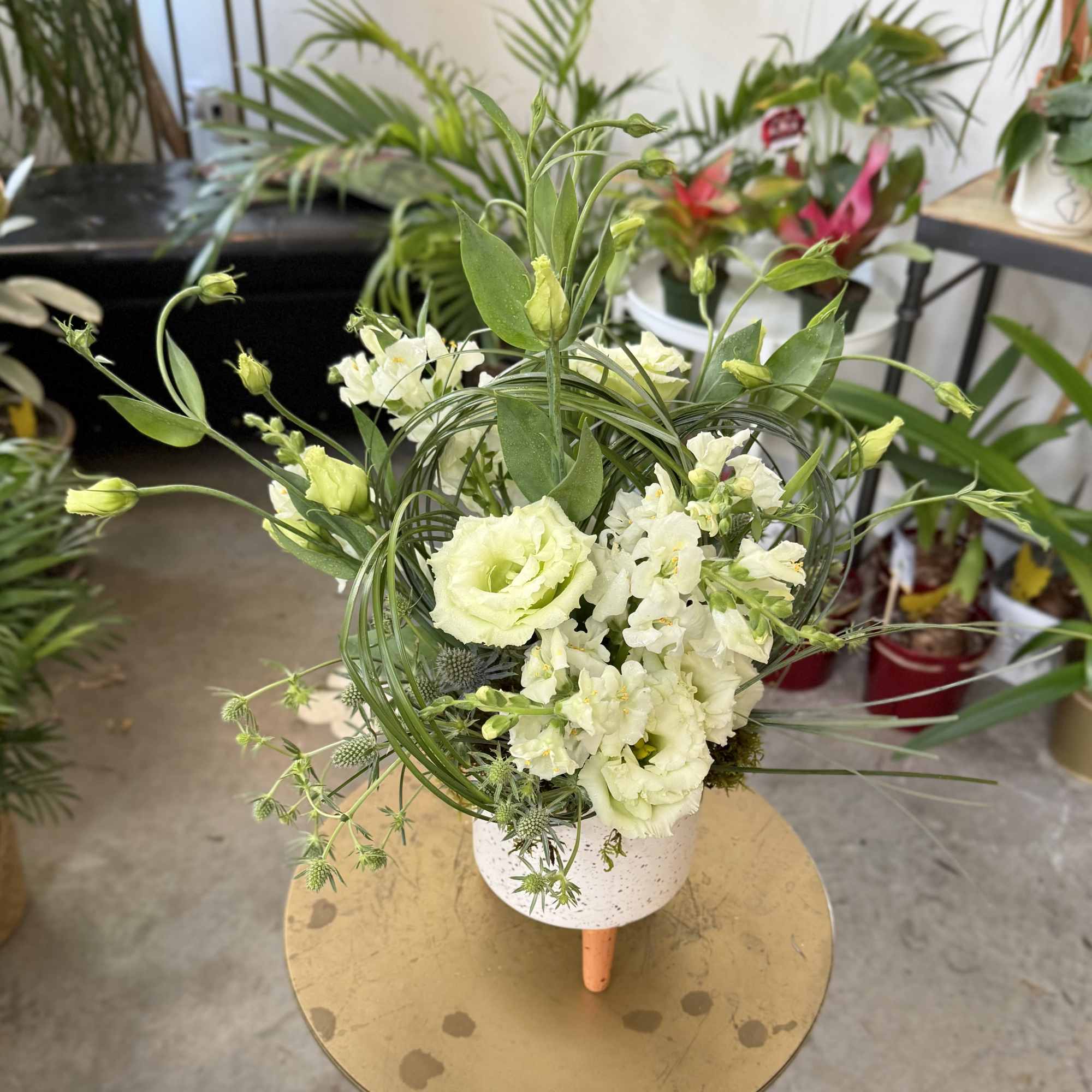 This lush, meadow style arrangement is filled to bursting with local blooms