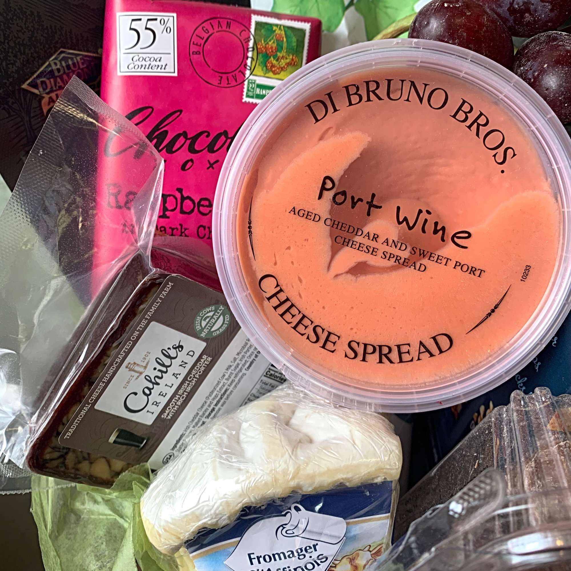 This Gourmet Gift Basket includes assorted cheeses, crackers, chocolates, nuts and fruit.