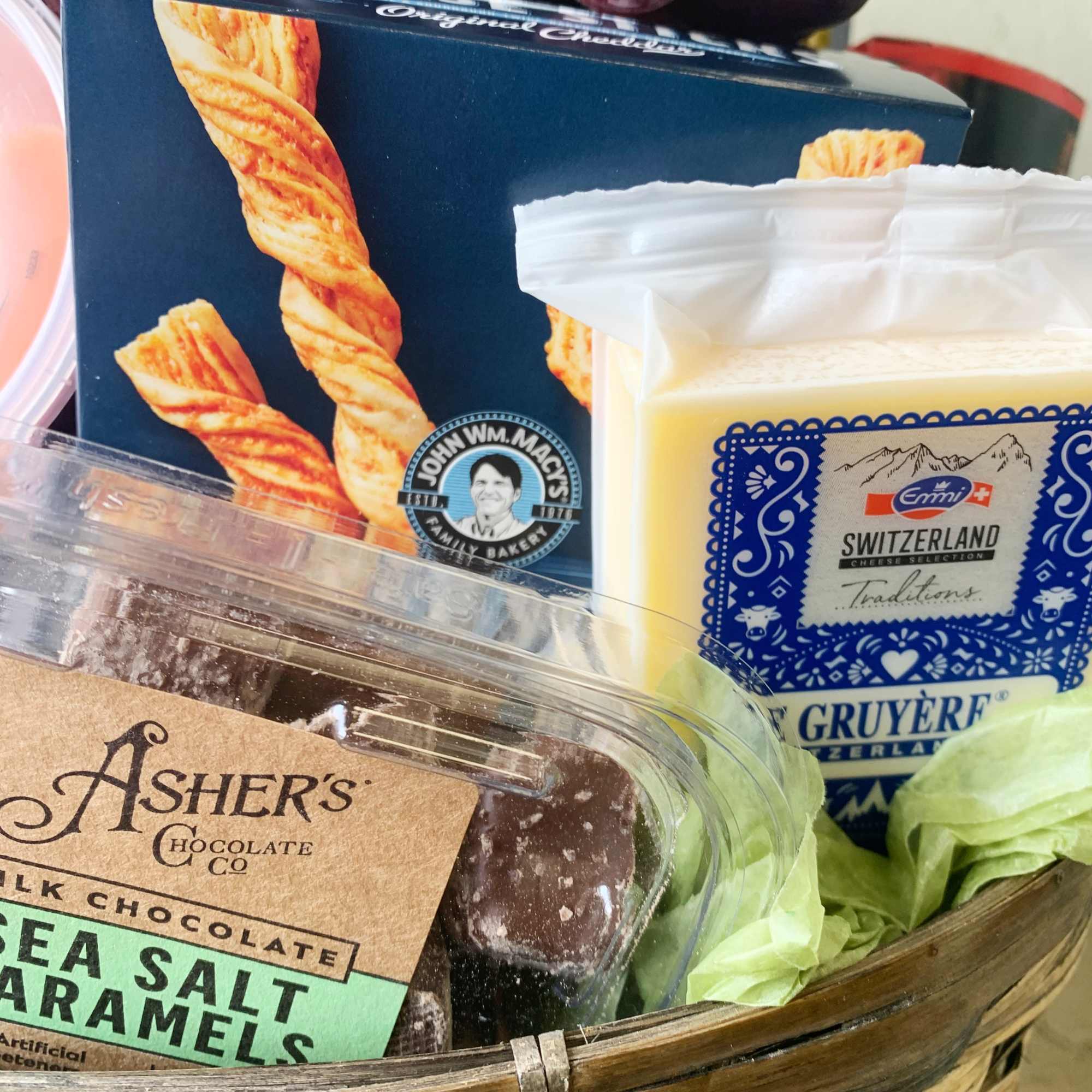 This Gourmet Gift Basket includes assorted cheeses, crackers, chocolates, nuts and fruit.