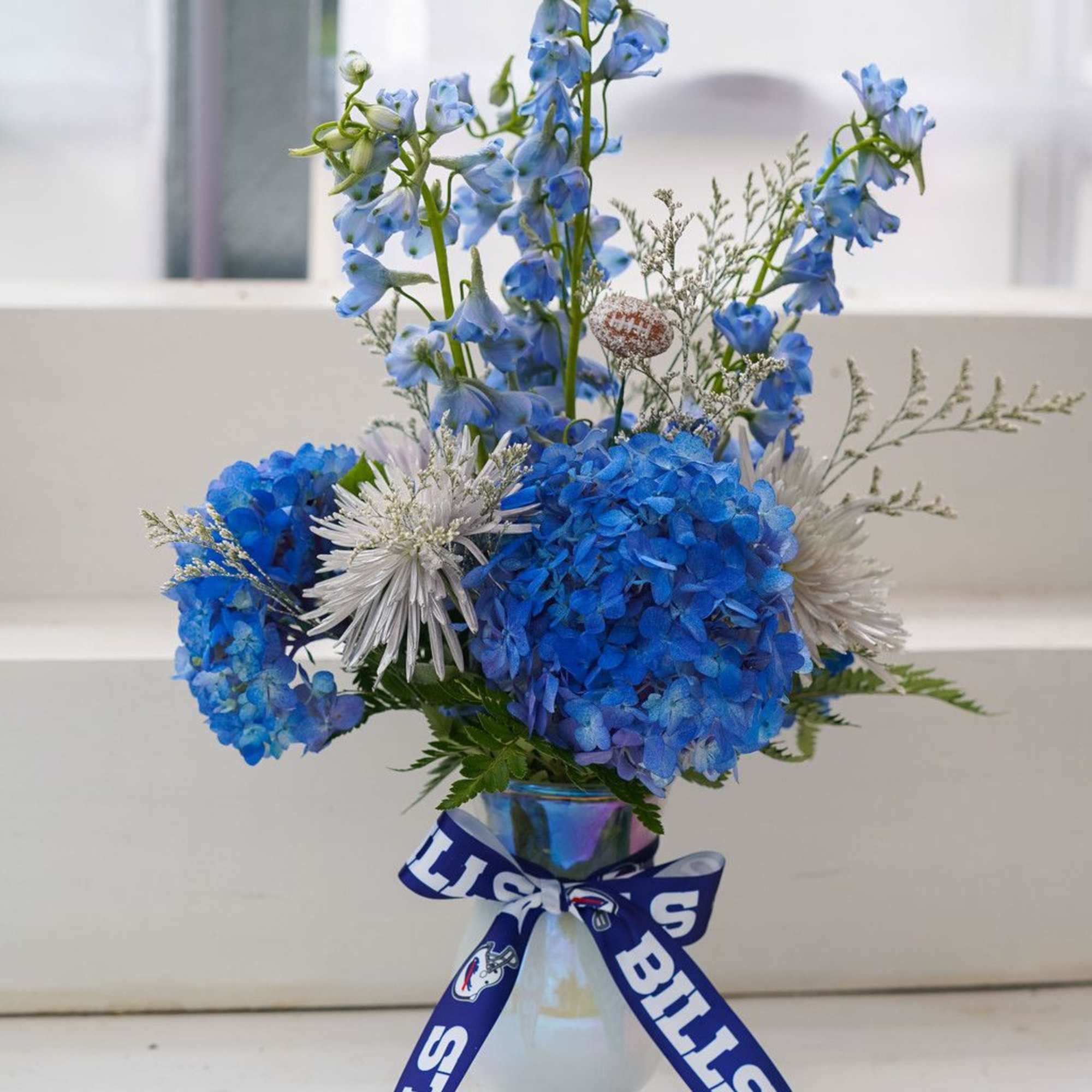 Cold Front Vase Arrangement
As crisp and bold as the Buffalo Bills’ new Cold Front Vase Arrangement
As crisp and bold as the Buffalo Bills’ new