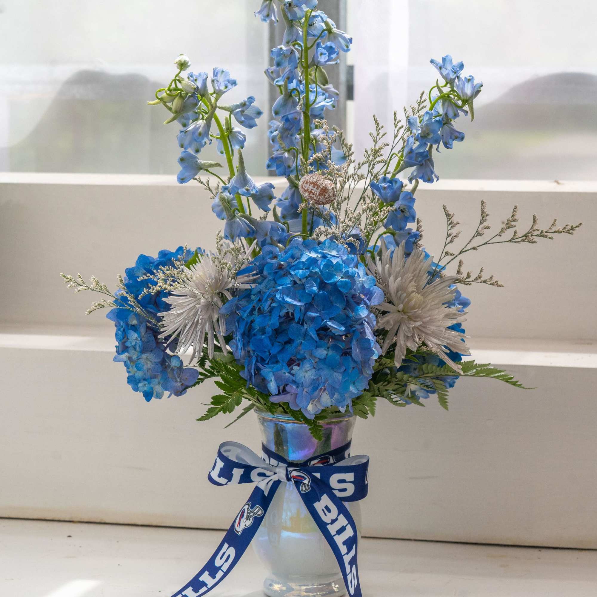 Cold Front Vase Arrangement
As crisp and bold as the Buffalo Bills’ new Cold Front Vase Arrangement
As crisp and bold as the Buffalo Bills’ new