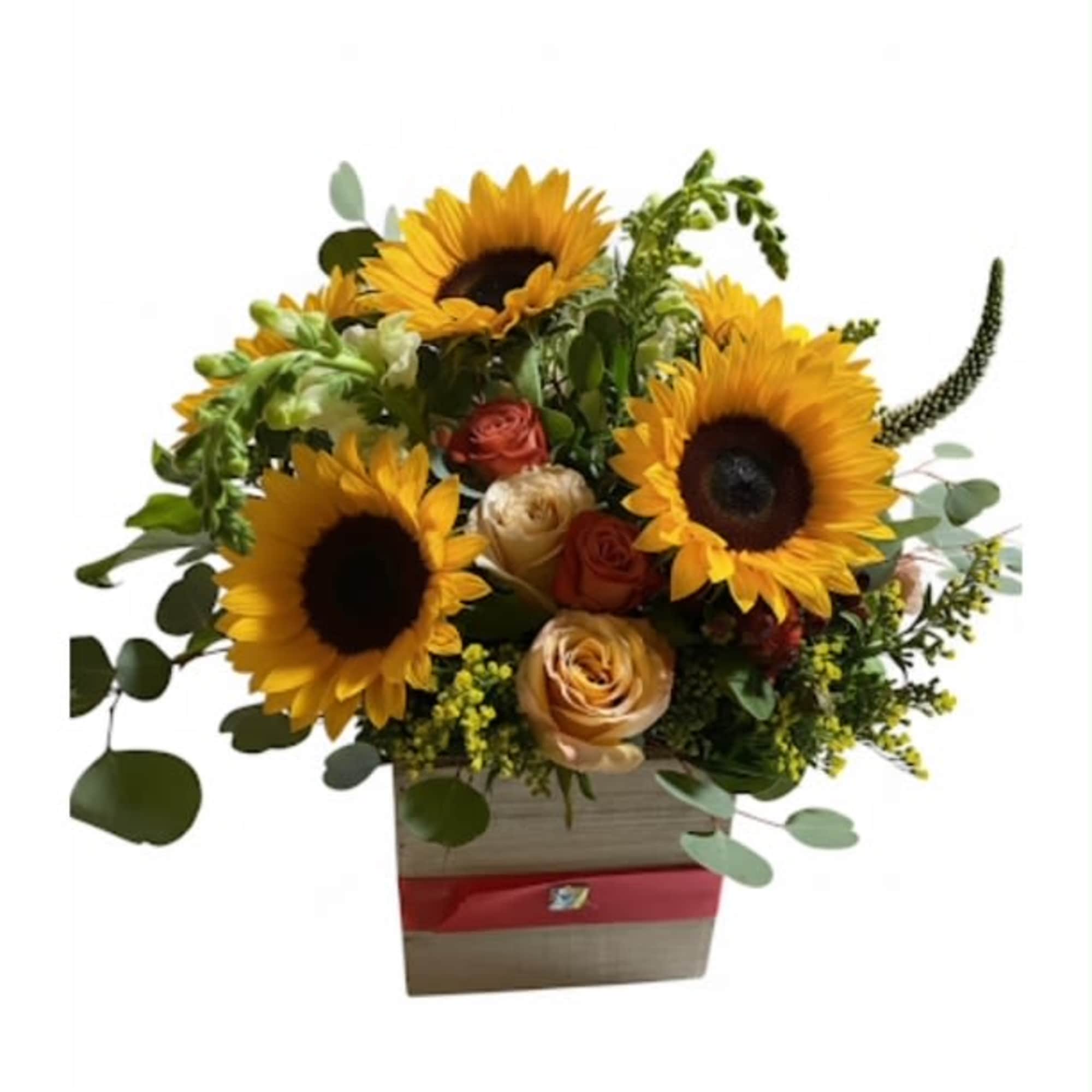 An elegant arrangement featuring roses, spray roses , hydrangeas, berries, greenery .This