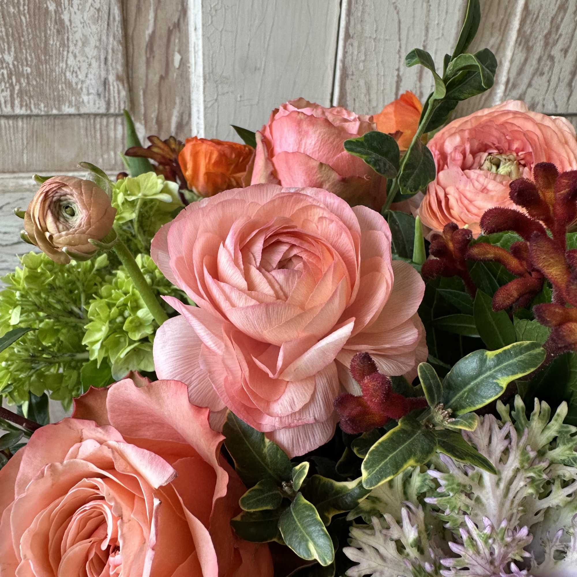 This elegant fall centerpiece is a beautiful mix of roses, hydrangea and
