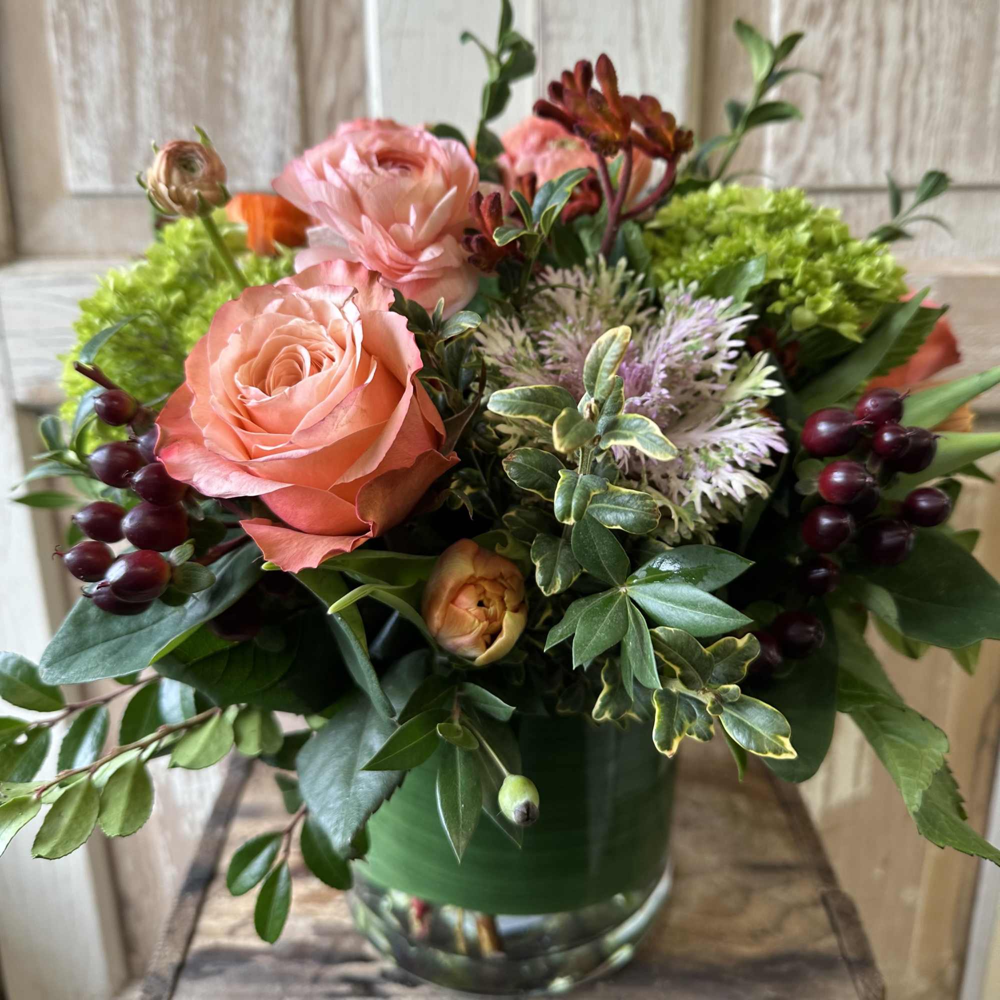 This elegant fall centerpiece is a beautiful mix of roses, hydrangea and
