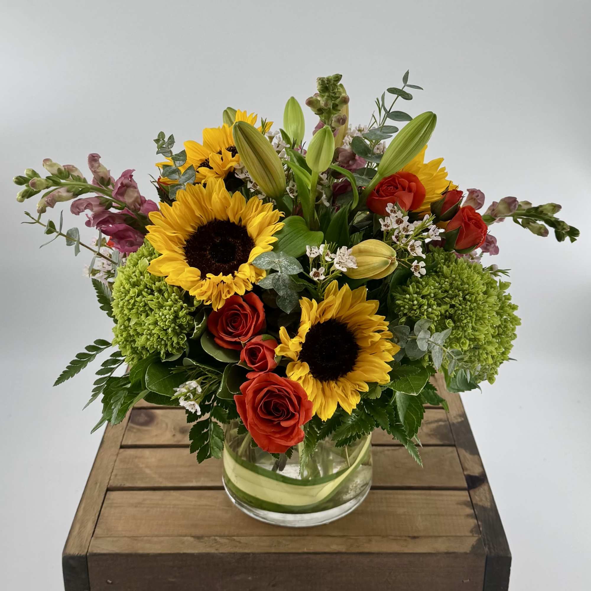 Elevate your special moments with this vibrant modern arrangement, expertly designed in