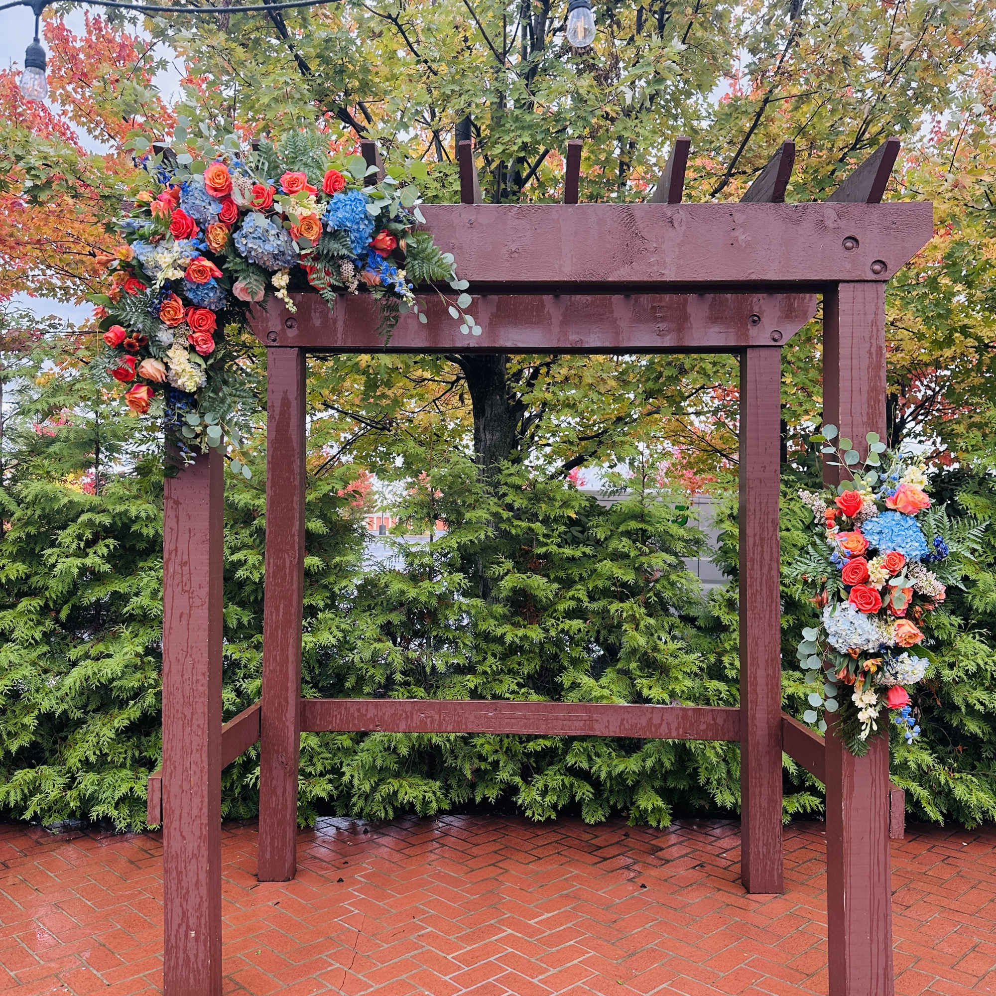 Beautiful two asymmetrical swags arch decor with bright fall bohemian colors of