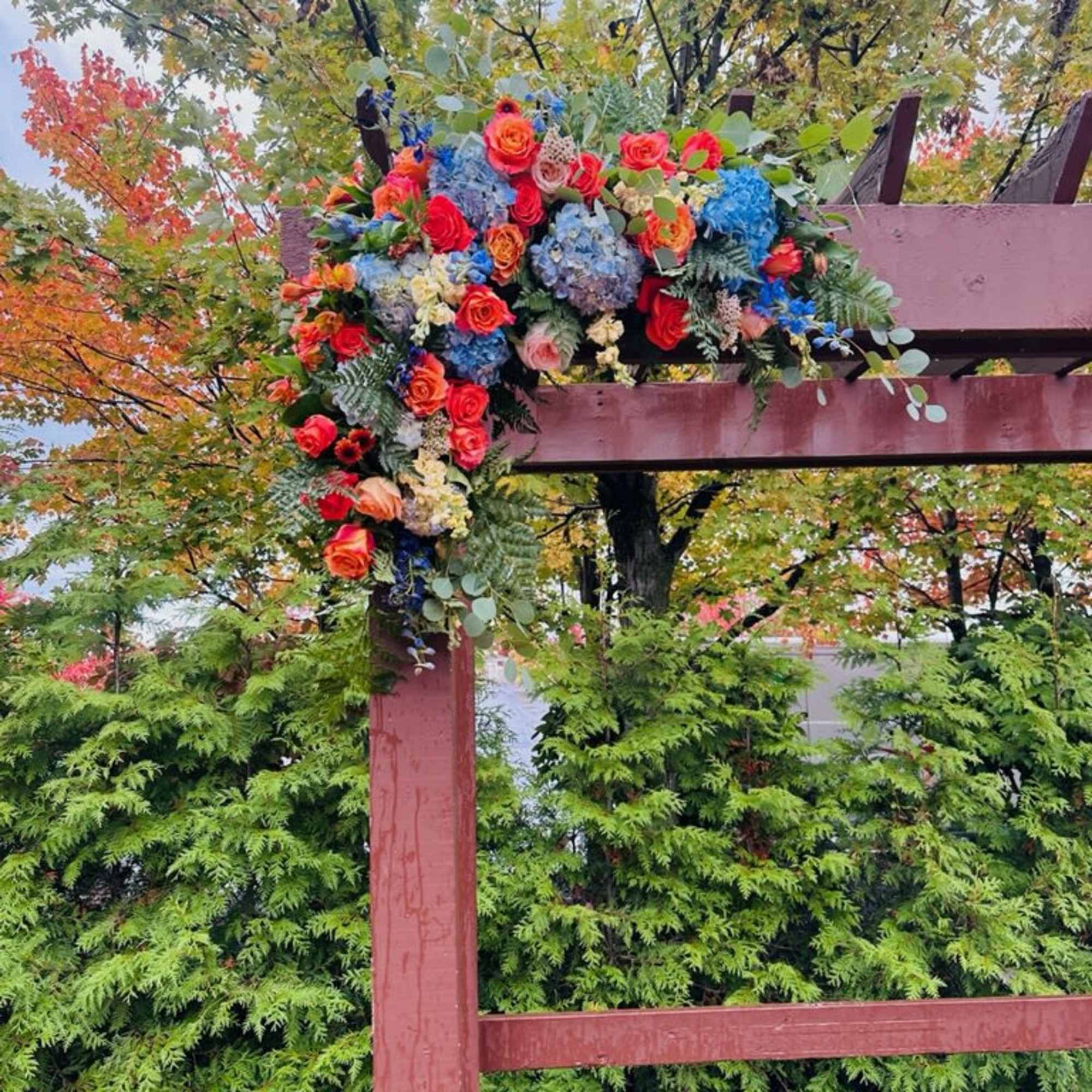 Beautiful two asymmetrical swags arch decor with bright fall bohemian colors of