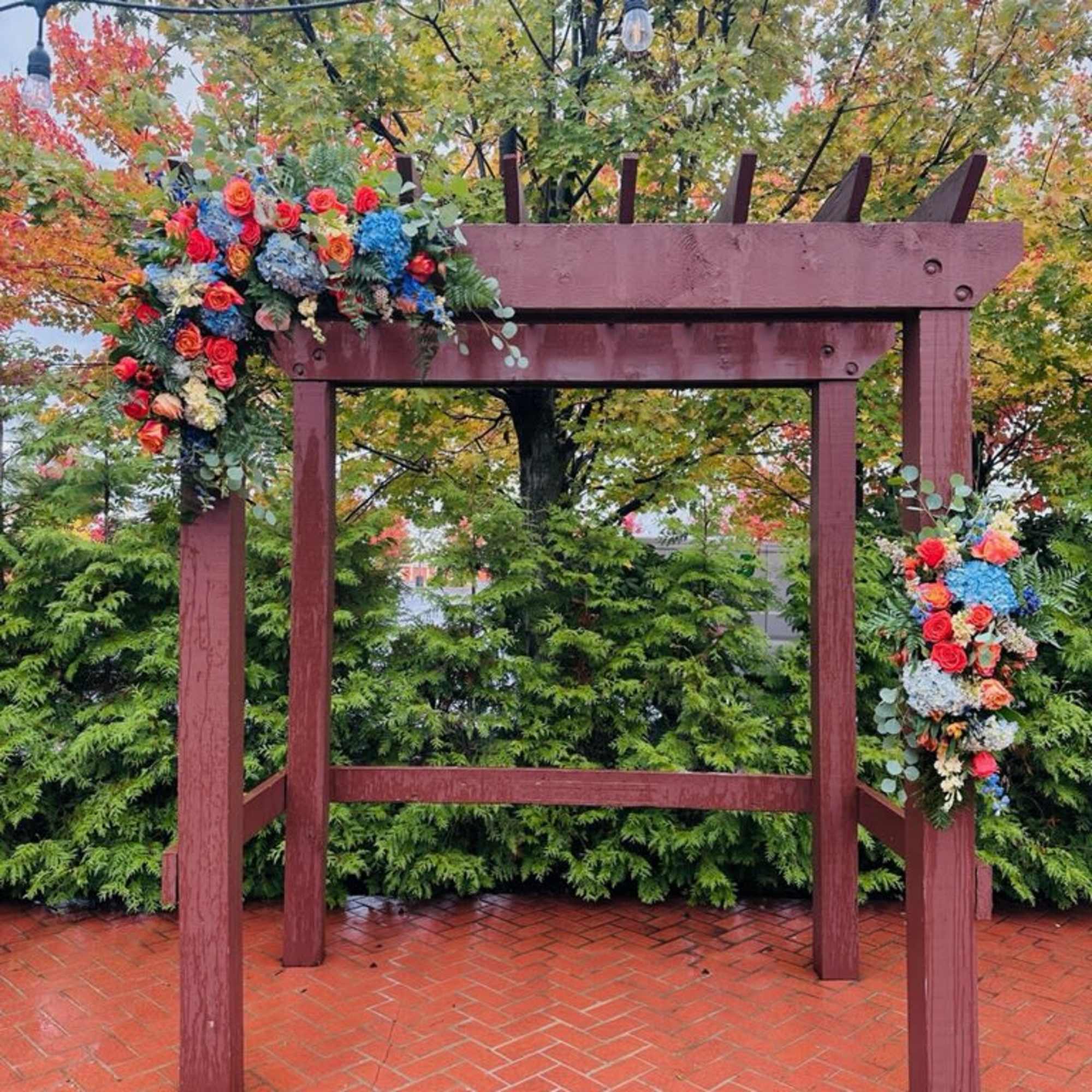 Beautiful two asymmetrical swags arch decor with bright fall bohemian colors of