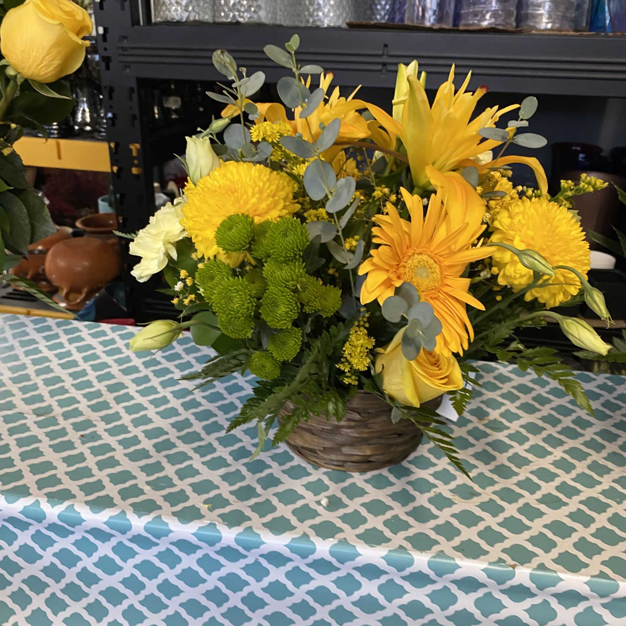 Small yellow basket of mixed flowers