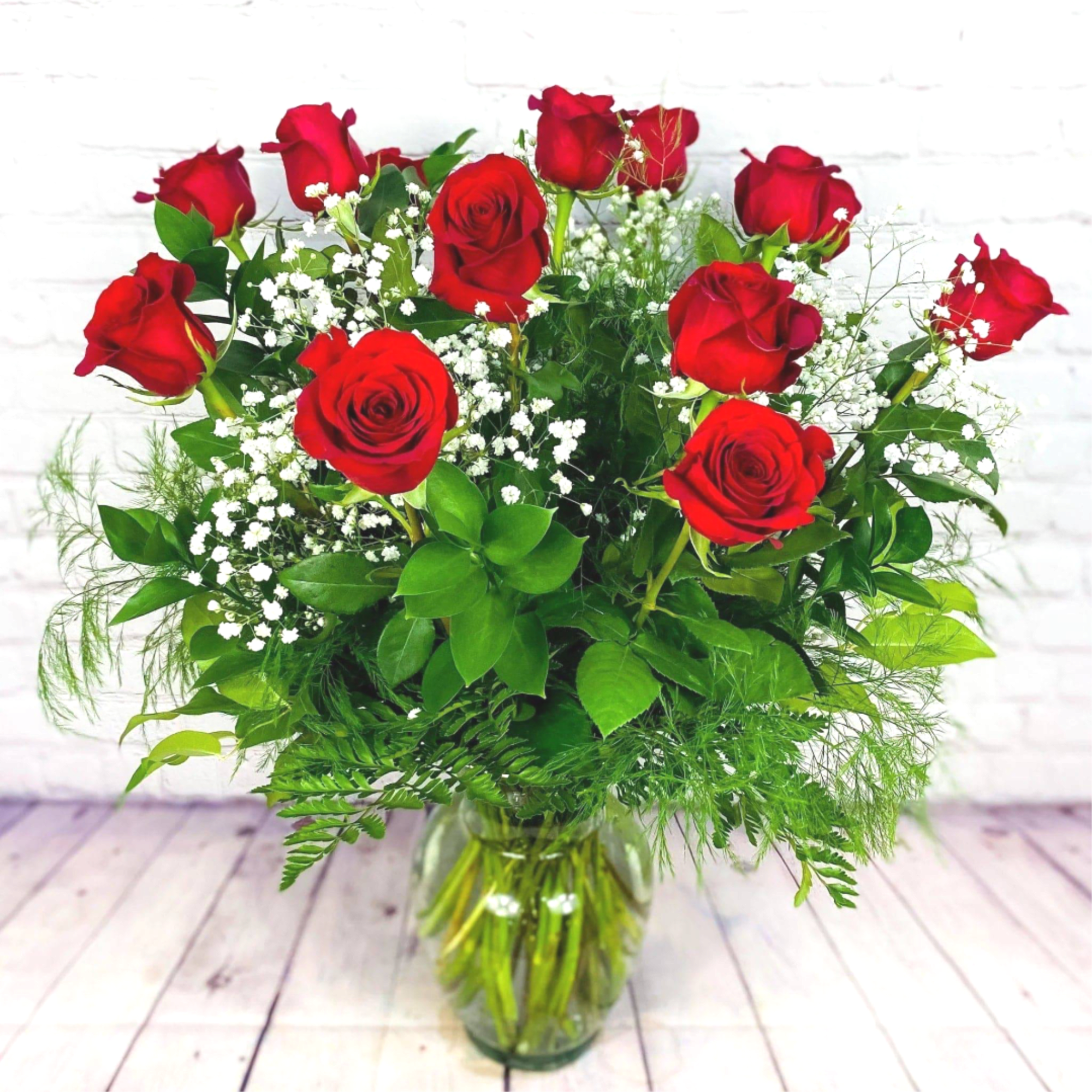 Experience the timeless elegance and romance of our Traditional Red Roses. These