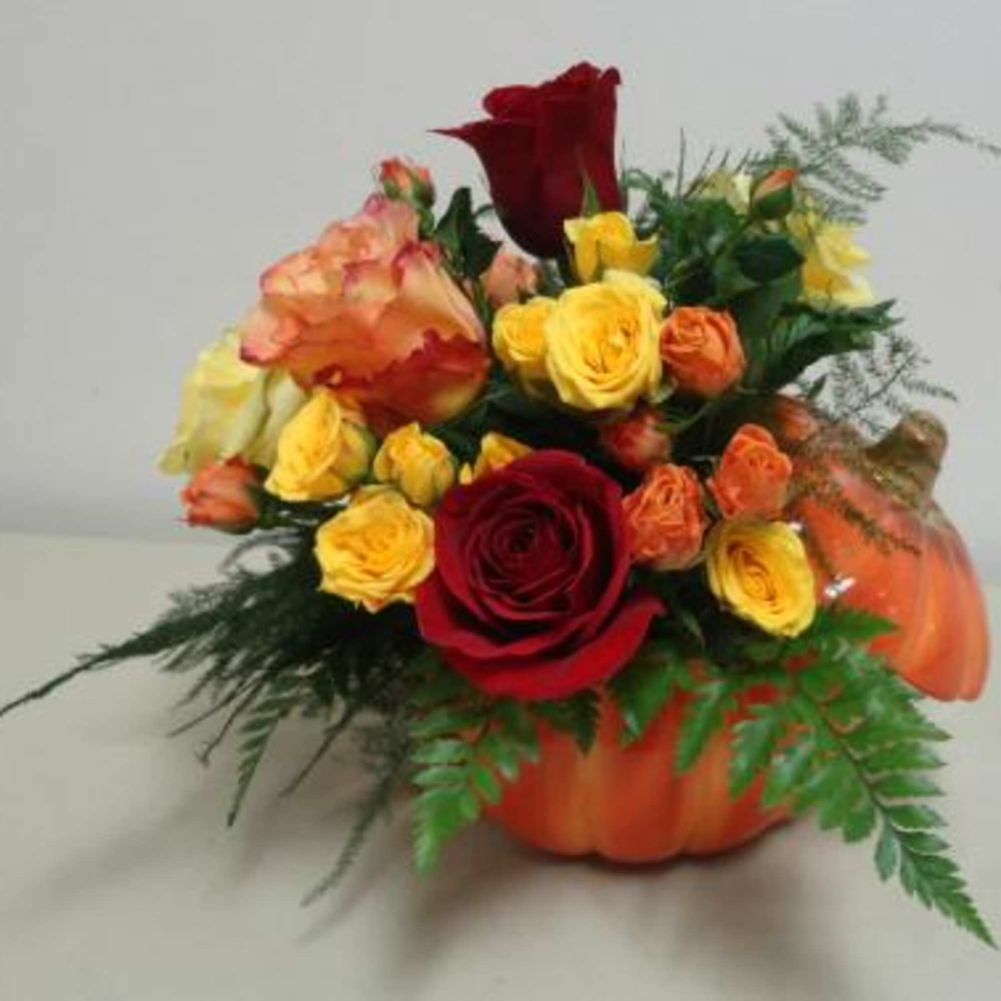 Pumpkin container with fresh roses. Pumpkin container may vary based on availability.