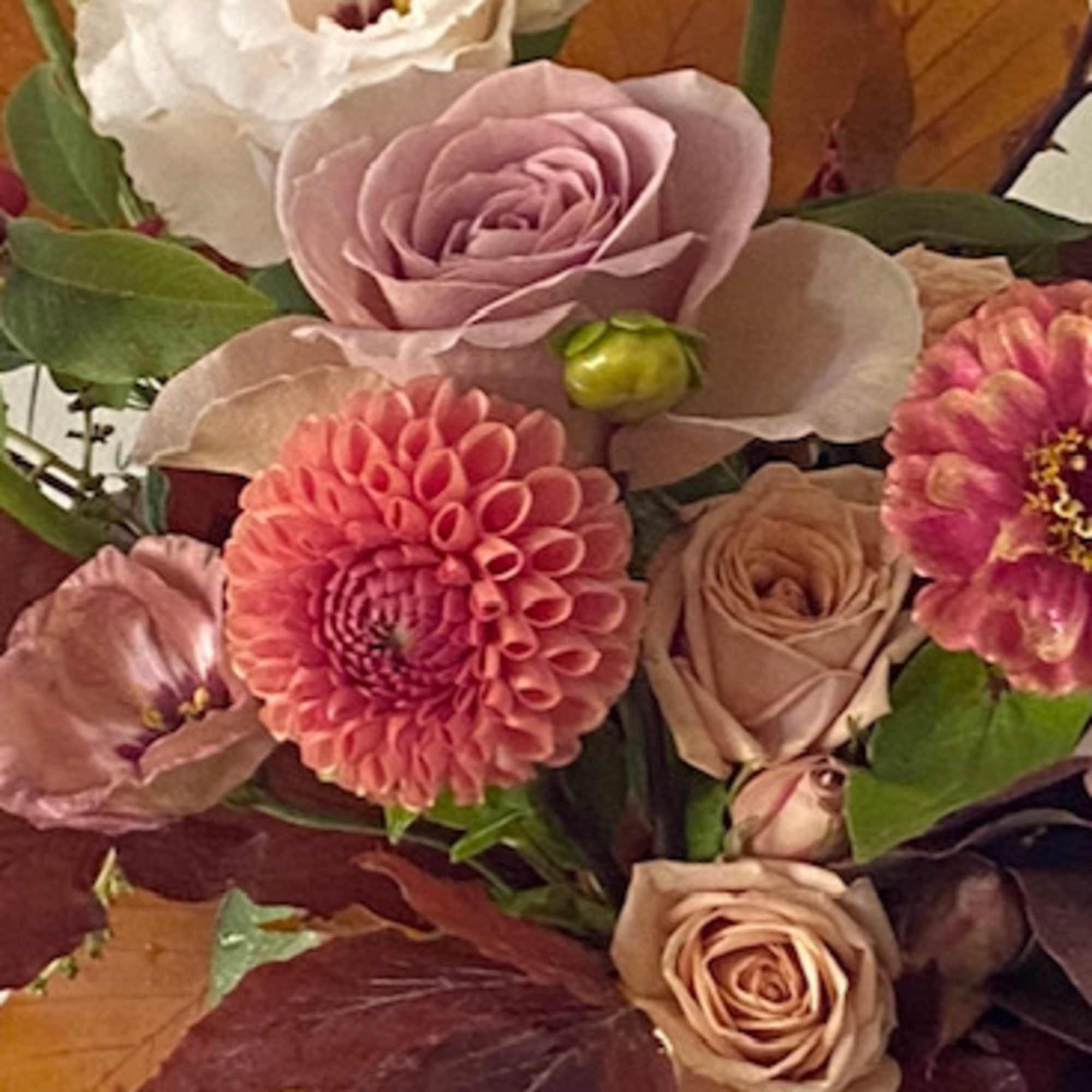 Seasonal blooms in a velvety fall palette of mauve, caramel, coral and