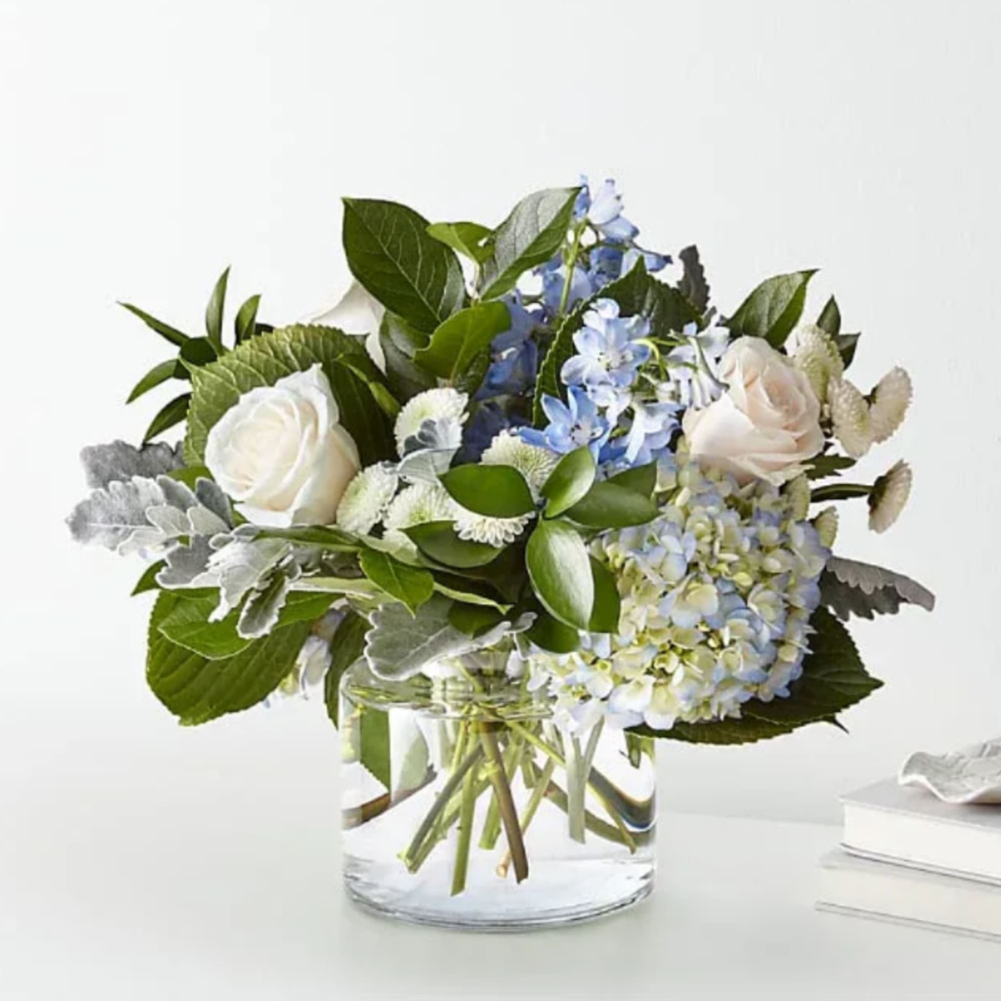 Let this uplifting arrangement be reminders of the clear skies ahead. Capturing