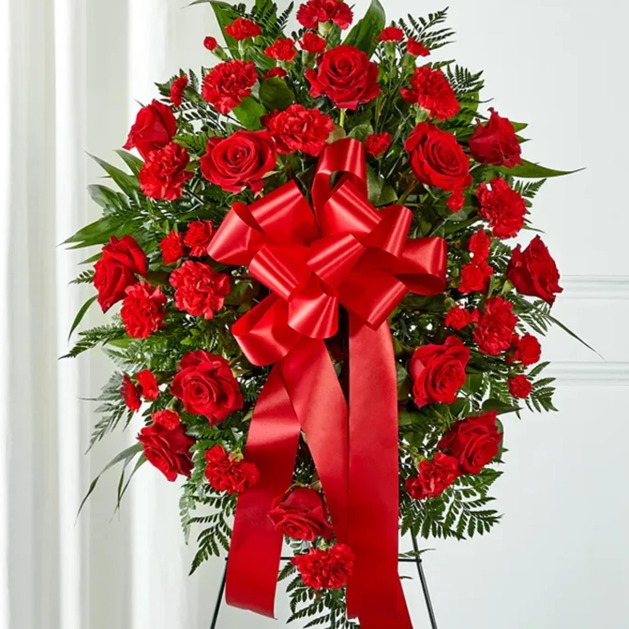 This Red Flower Standing Spray is hand arranged by DGM Flowers with