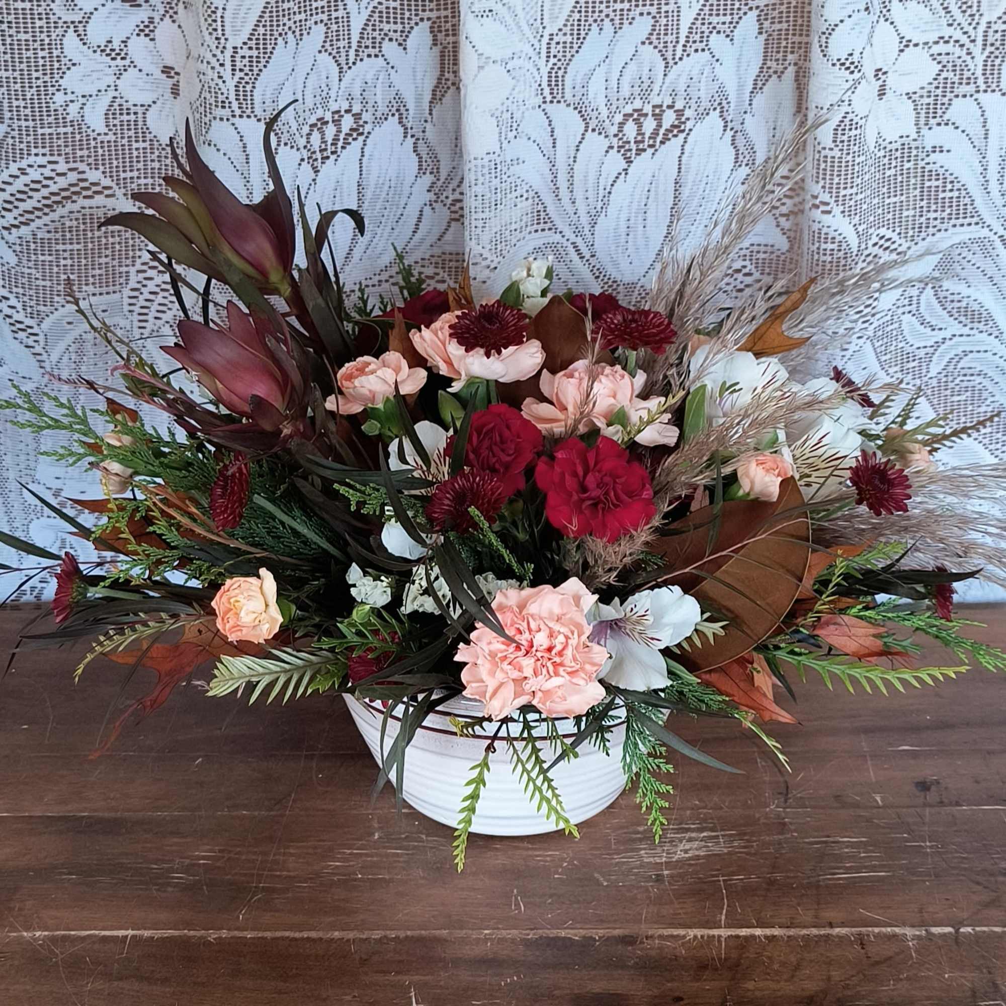 Brighten their day with a Timeless treasured Bouquet, showcasing radiant red and