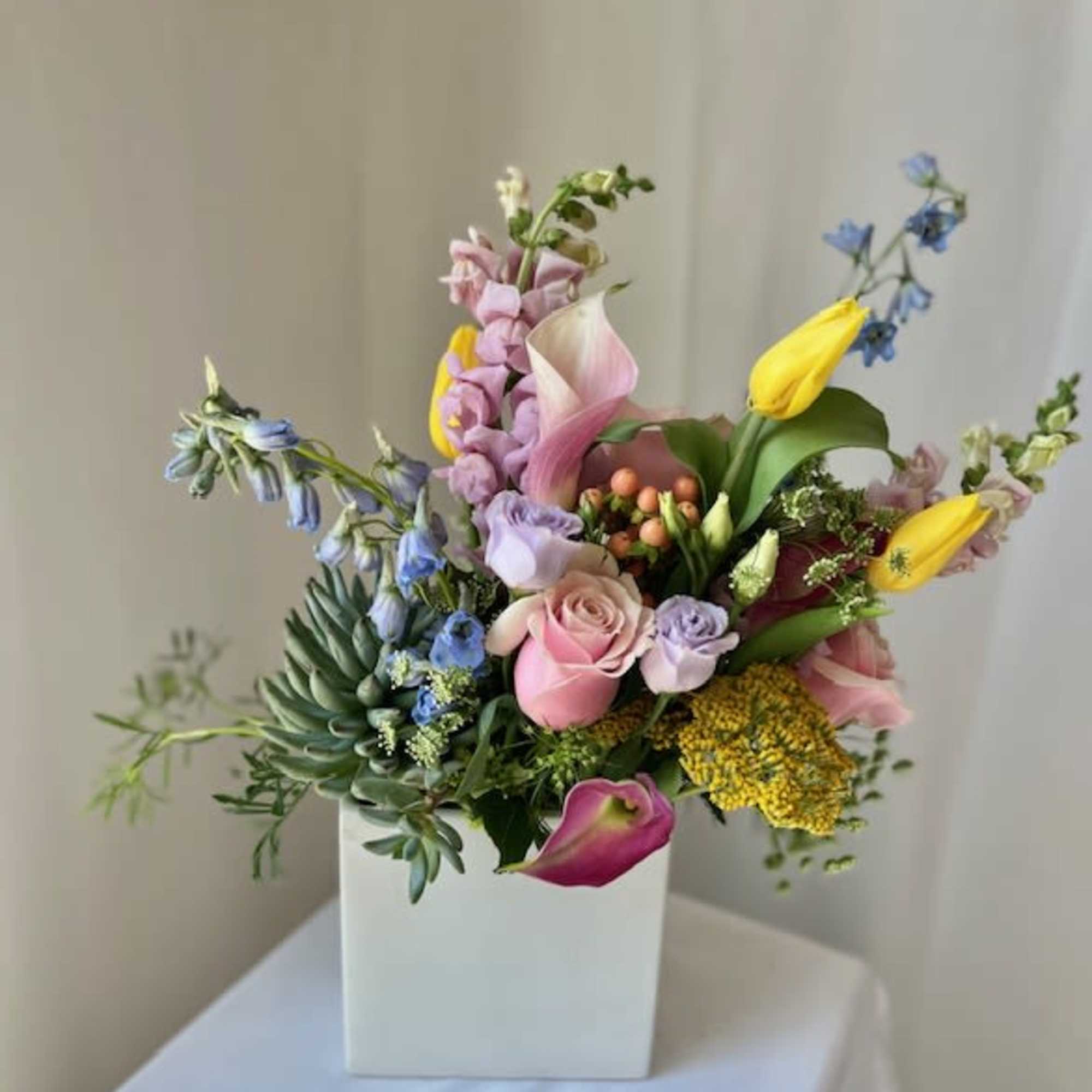 This arrangement is perfect for a plant and flower lover combined! We