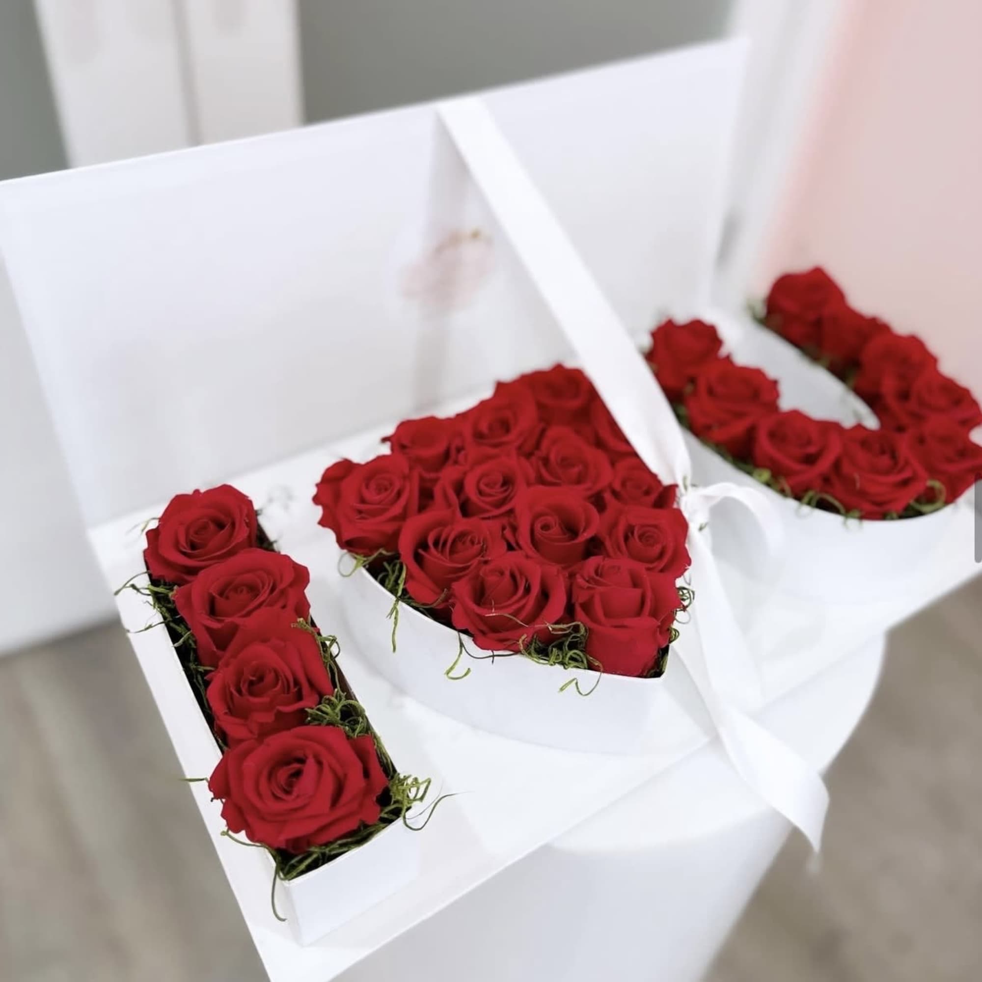 A stunning floral arrangement spelling out &quot; I 