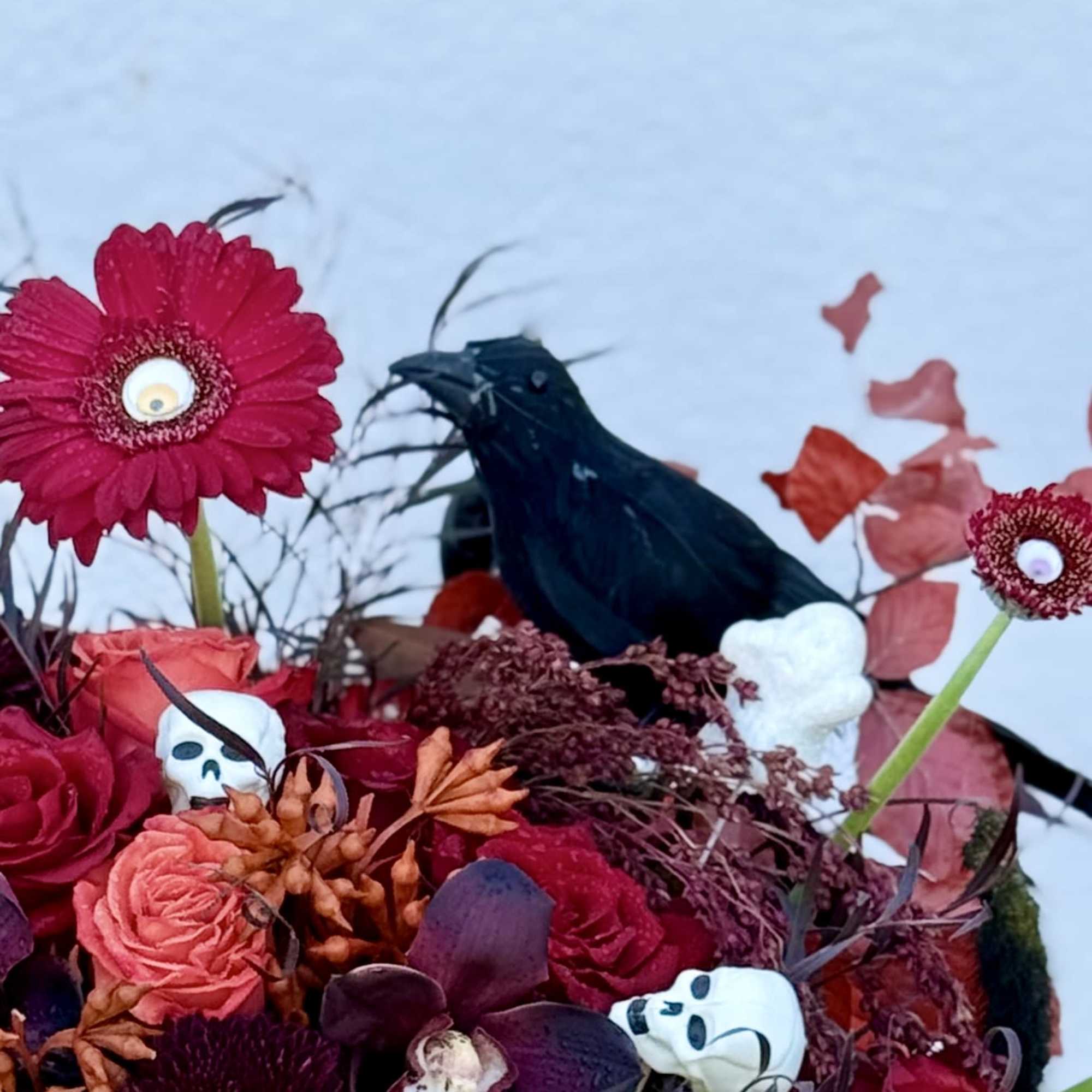 Make a bold statement this Halloween with our Dark Enchantment floral arrangement