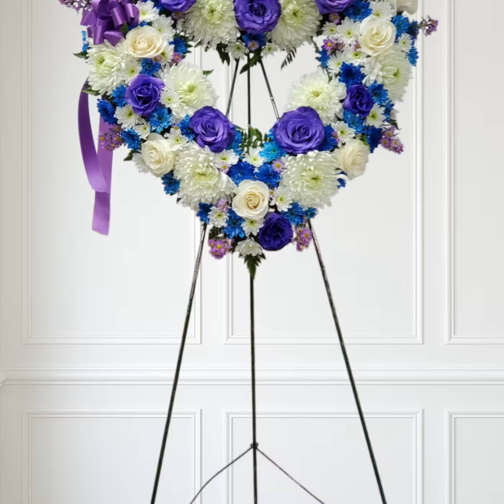 Blue flowers with deep purple roses and white flowers. Blue flowers with deep purple roses and white flowers.