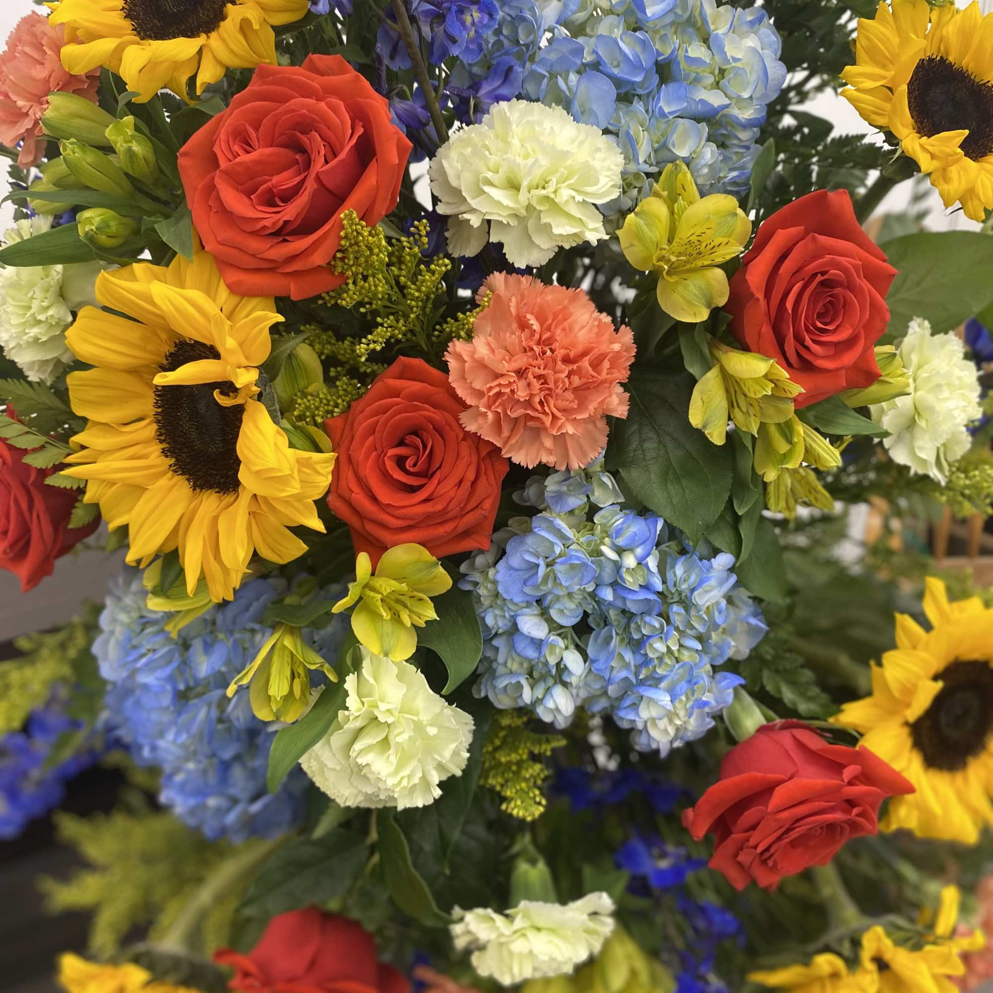 This breath taking standing spray is bright and full of love. These