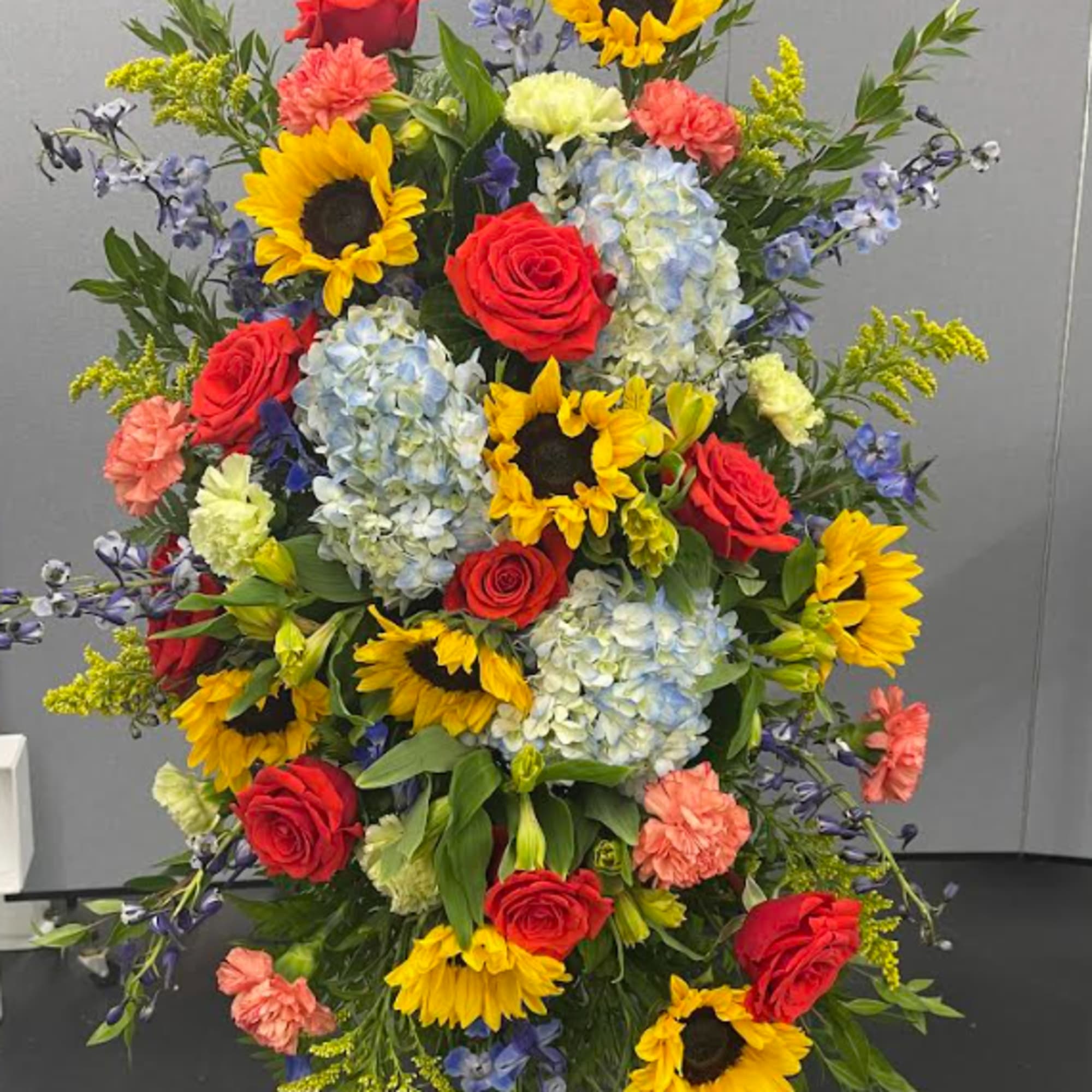 This breath taking standing spray is bright and full of love. These