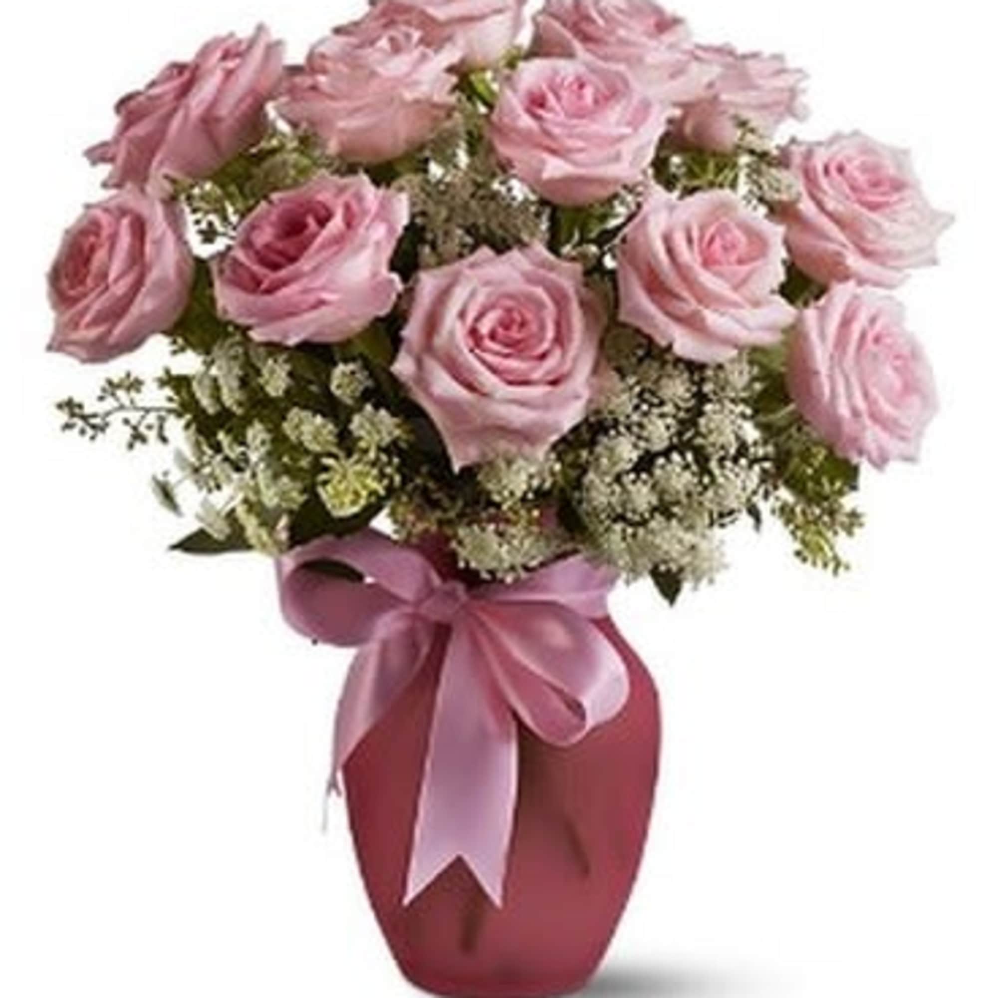 A vision of sheer loveliness, this exquisite arrangement of pink roses and