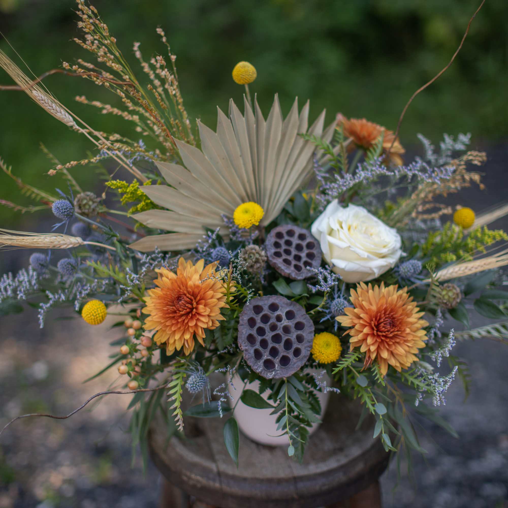 A perfect medley of fresh and dried floral materials artfully arranged in