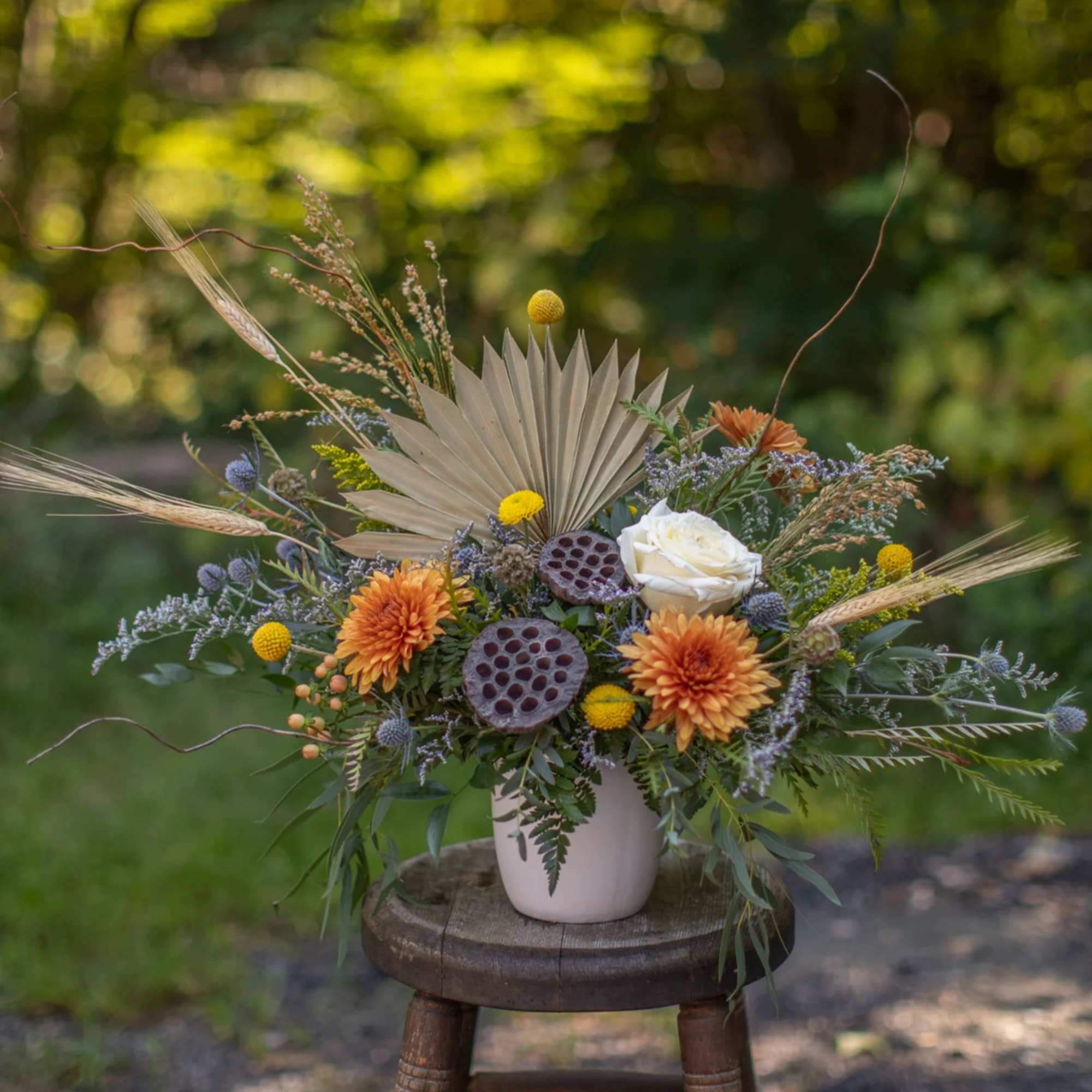 A perfect medley of fresh and dried floral materials artfully arranged in