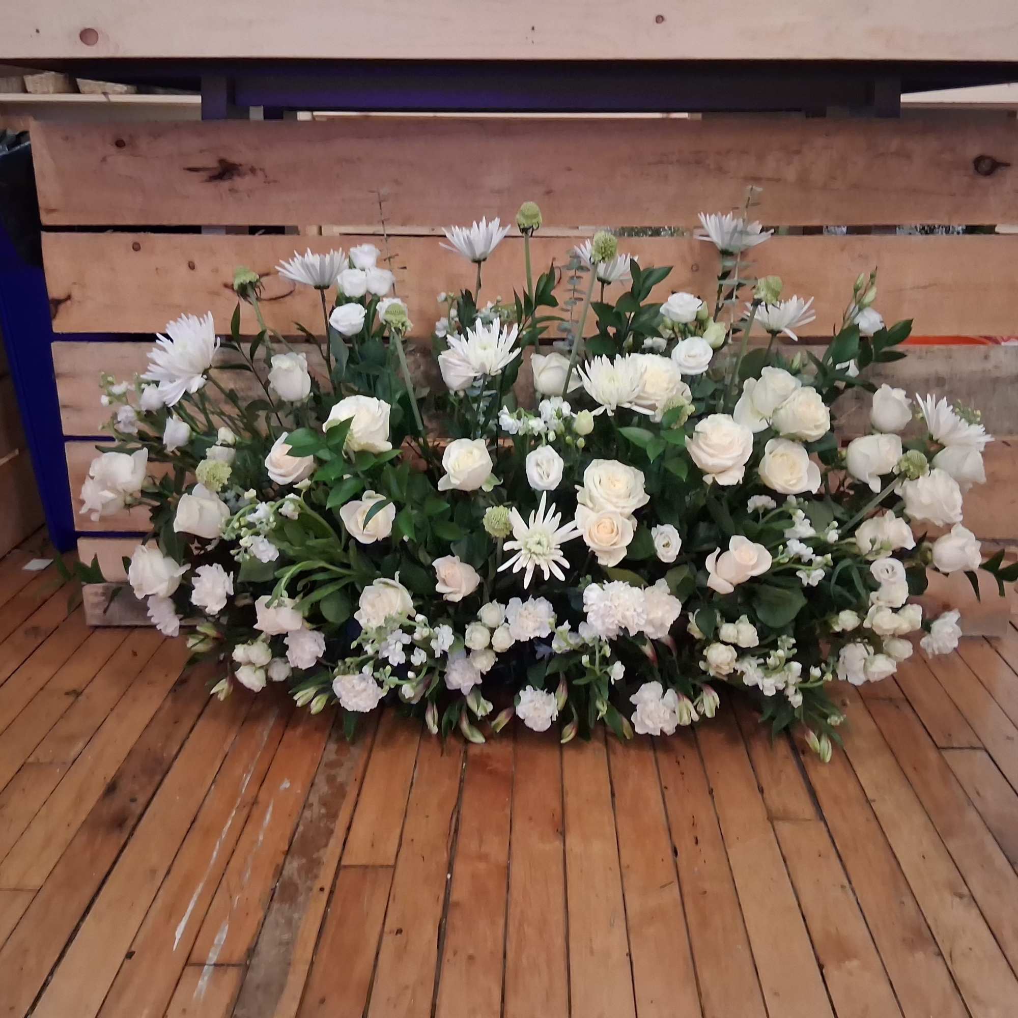 Beautiful garden style under table sweetheart table centerpiece of white roses, carnations