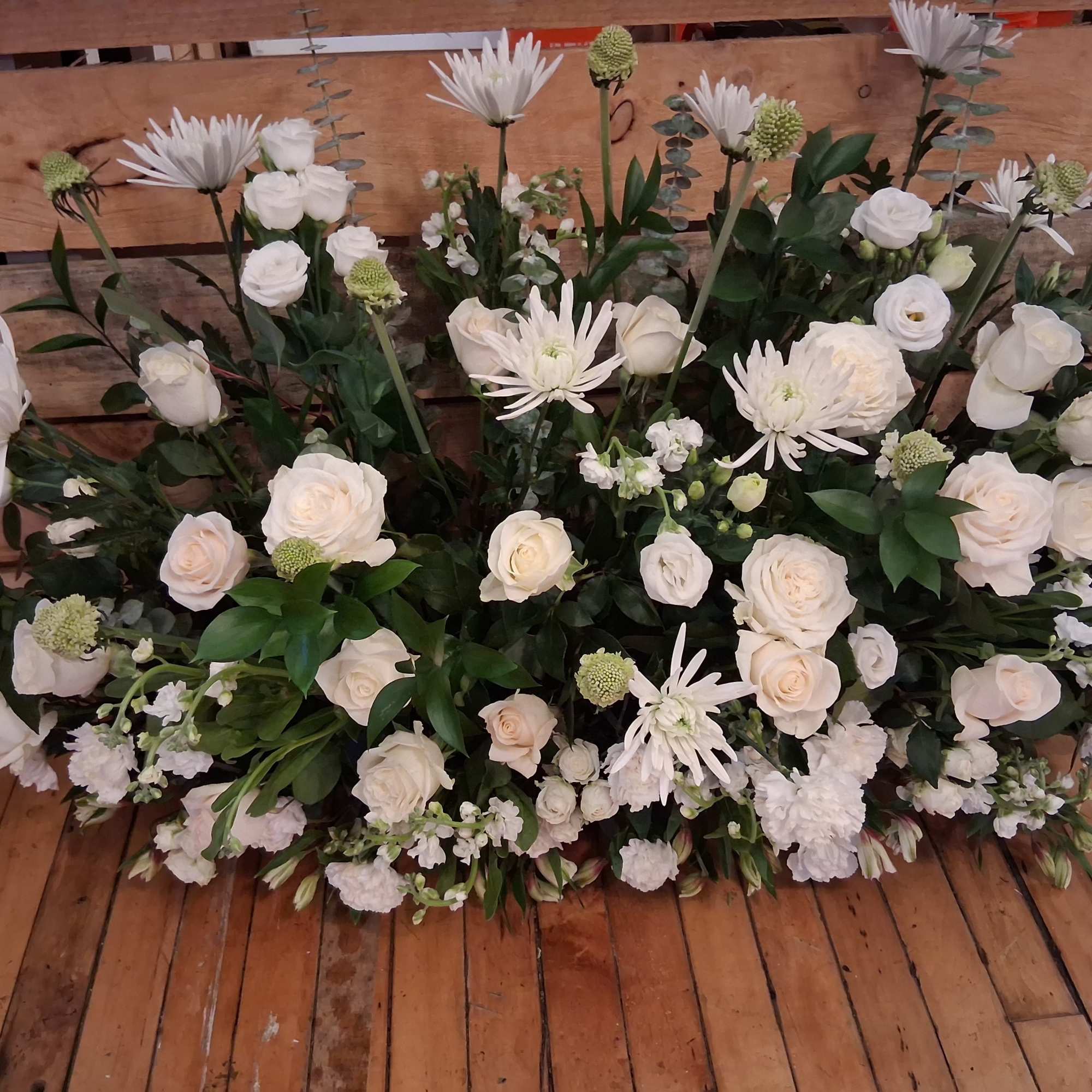 Beautiful garden style under table sweetheart table centerpiece of white roses, carnations