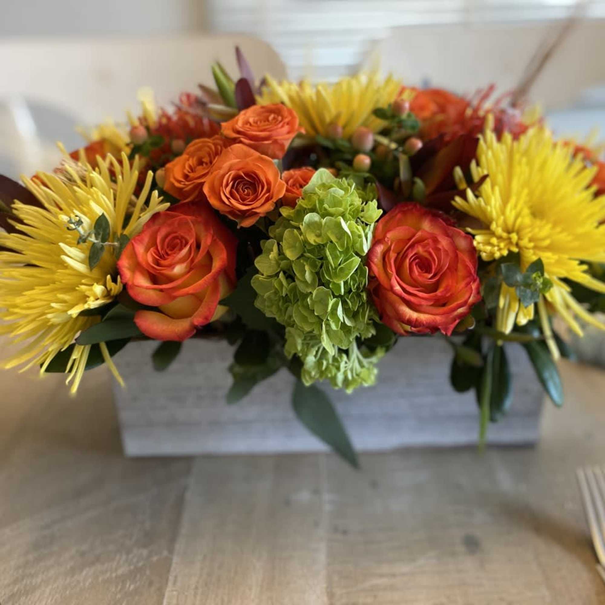 Beautiful table centerpiece, arranged in a  10 inch long rectangular 