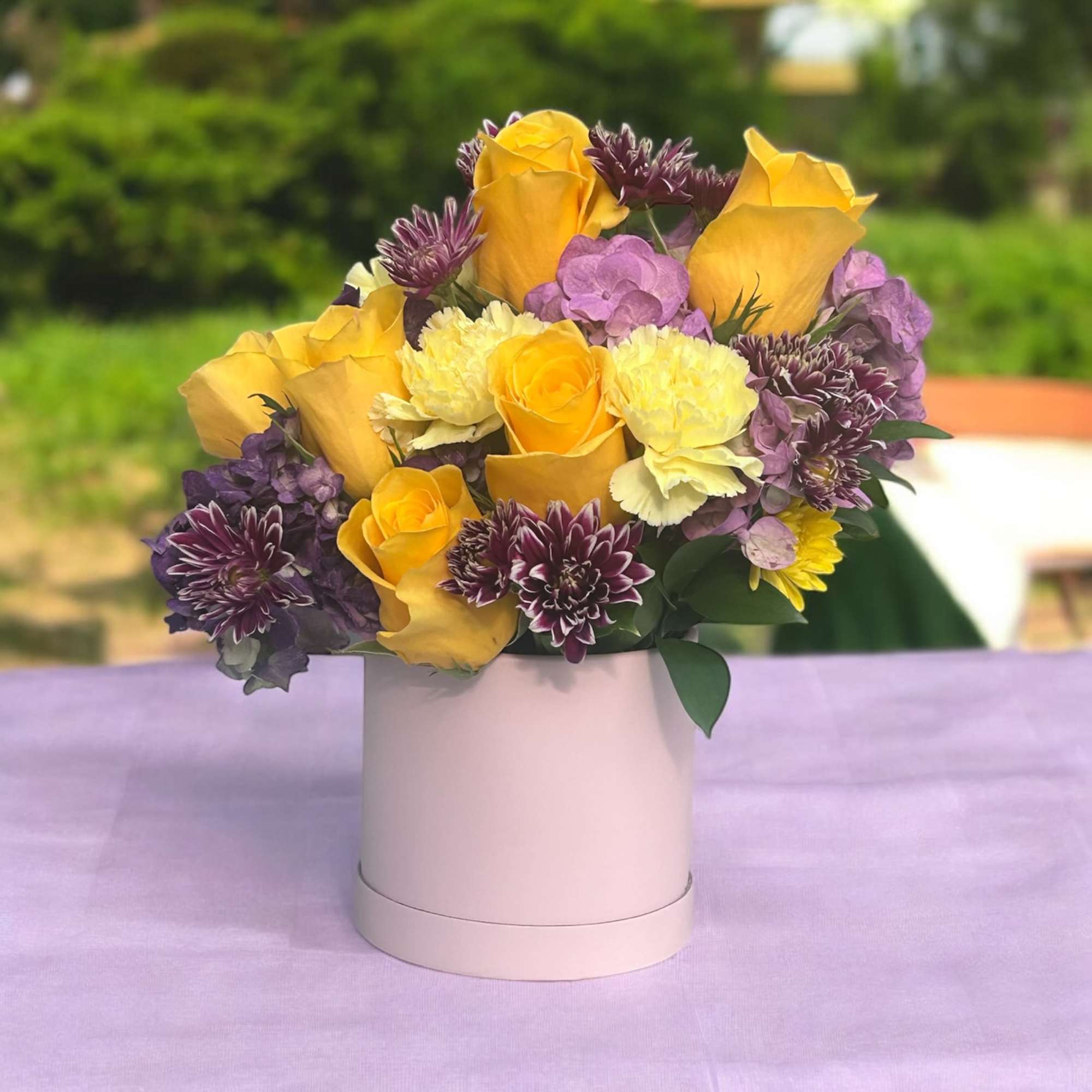 Lavender Blooms is a graceful and soothing floral arrangement that captures the