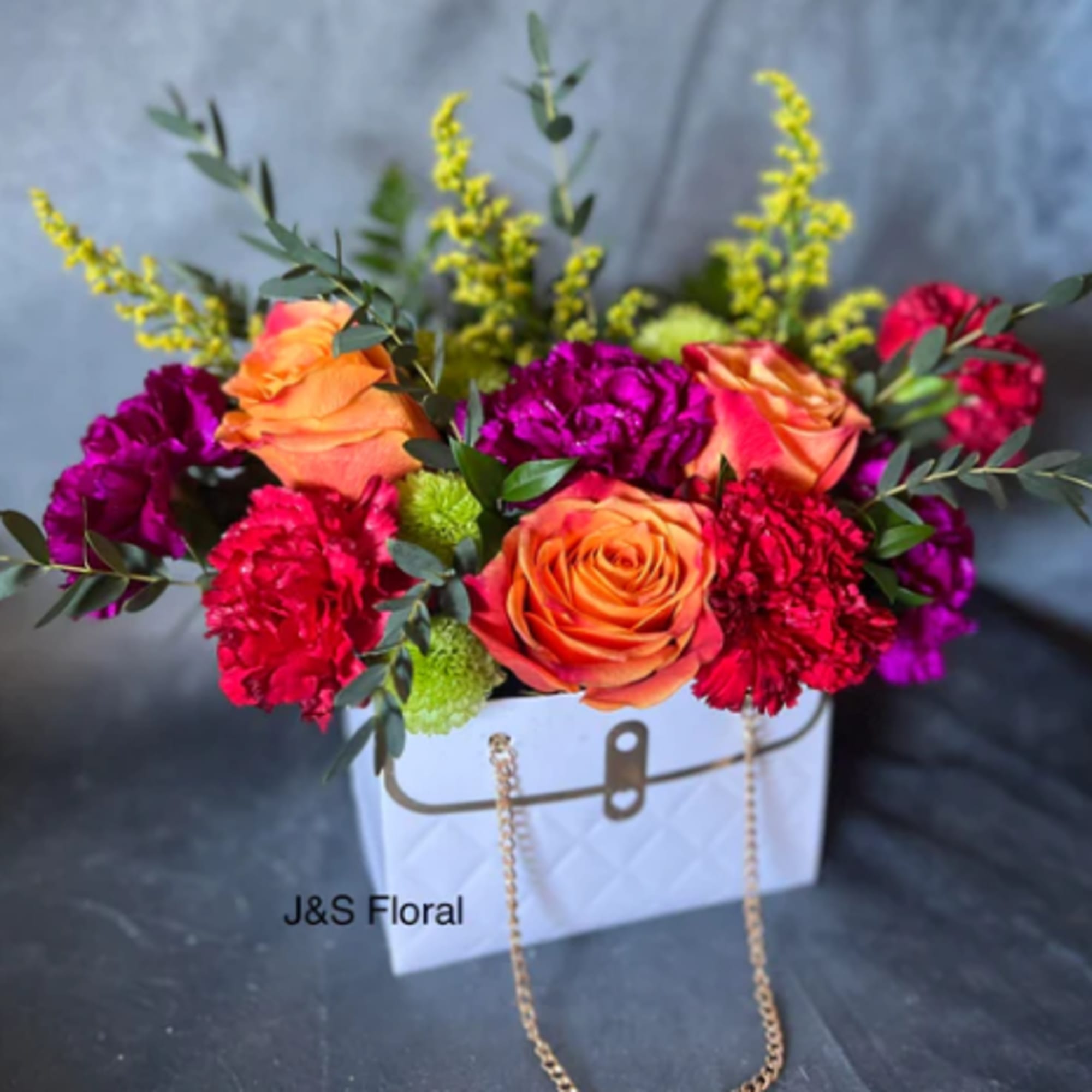 Step into a world of vibrant delight with our cheerful flower arrangement