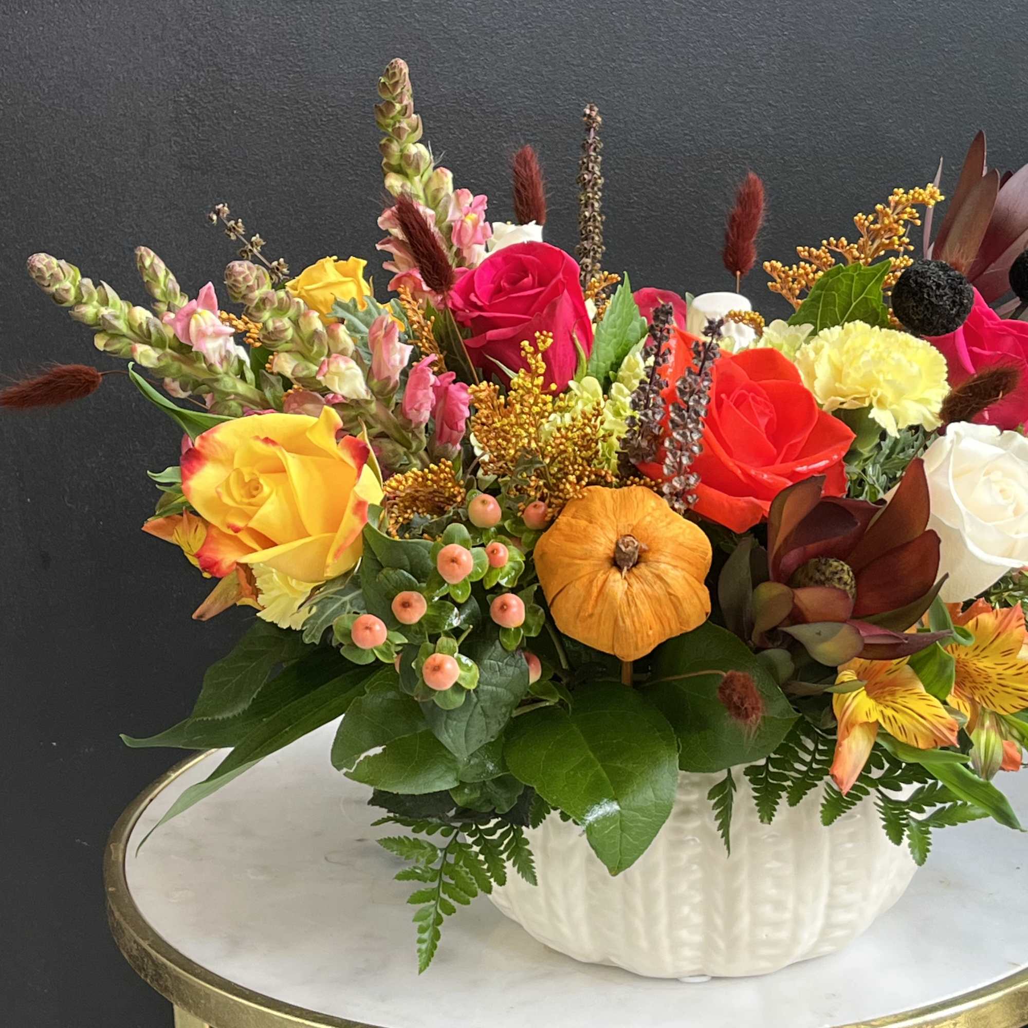 Fall assortment of Sunflowers, Leucadendron, Mums, Waxflower, Spray Roses and Assorted Greenery