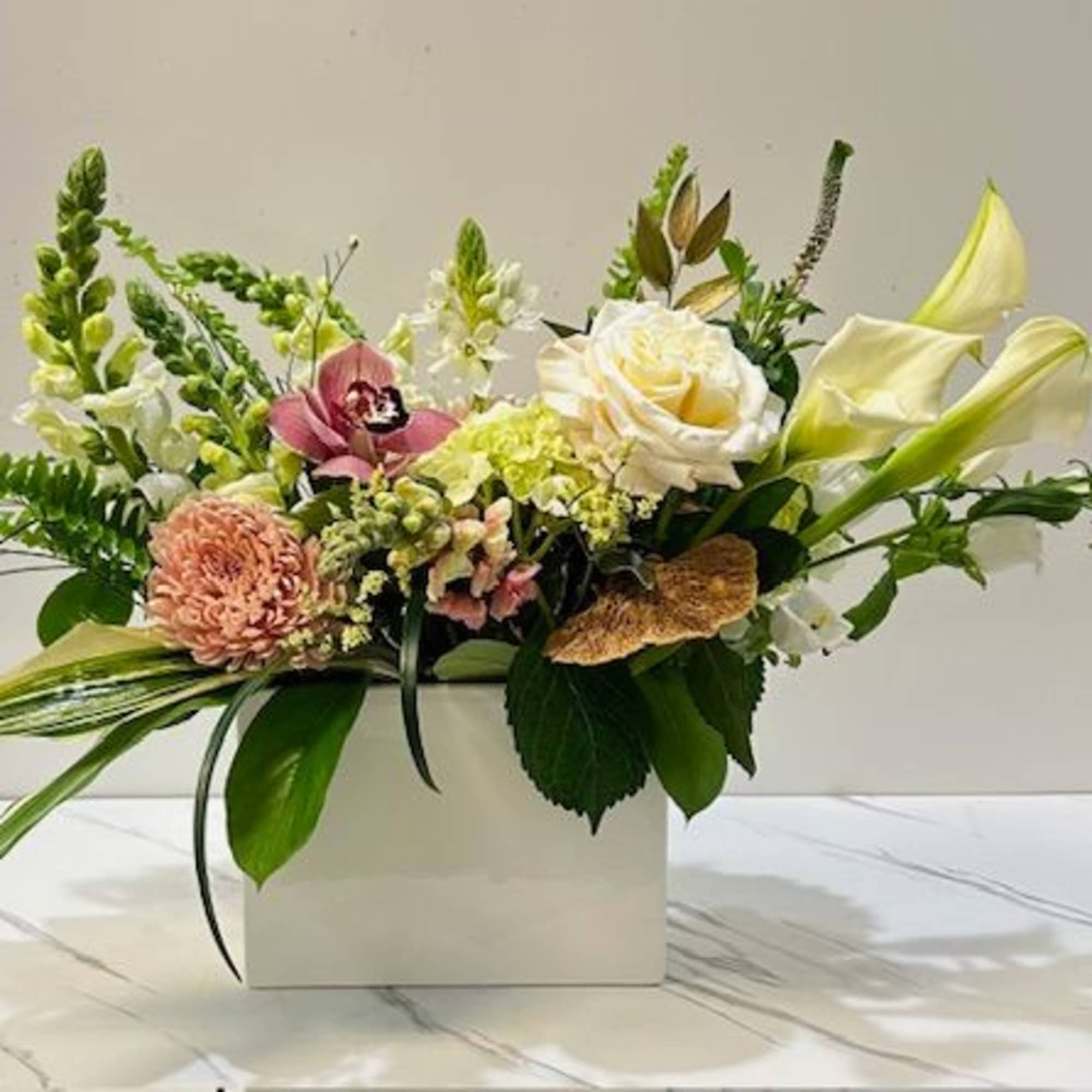 Delicate and refined, Soft &amp; Blush is an upscale floral arrangement that