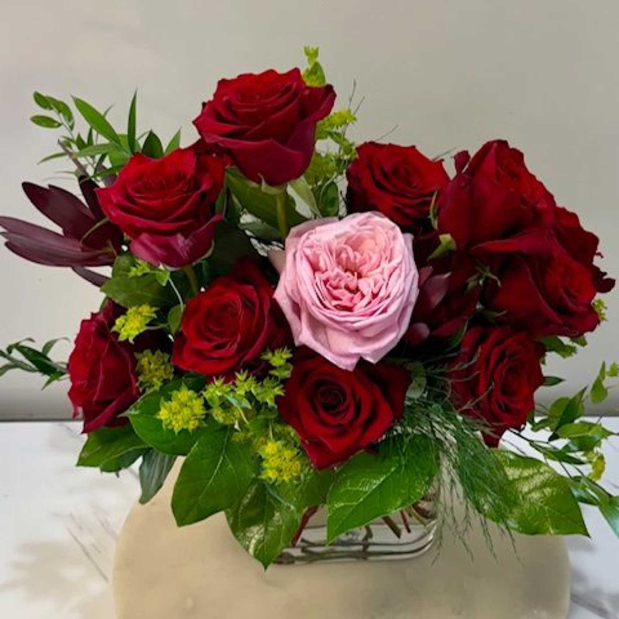 A breathtaking arrangement that speaks of love, devotion, and individuality. Eleven deep