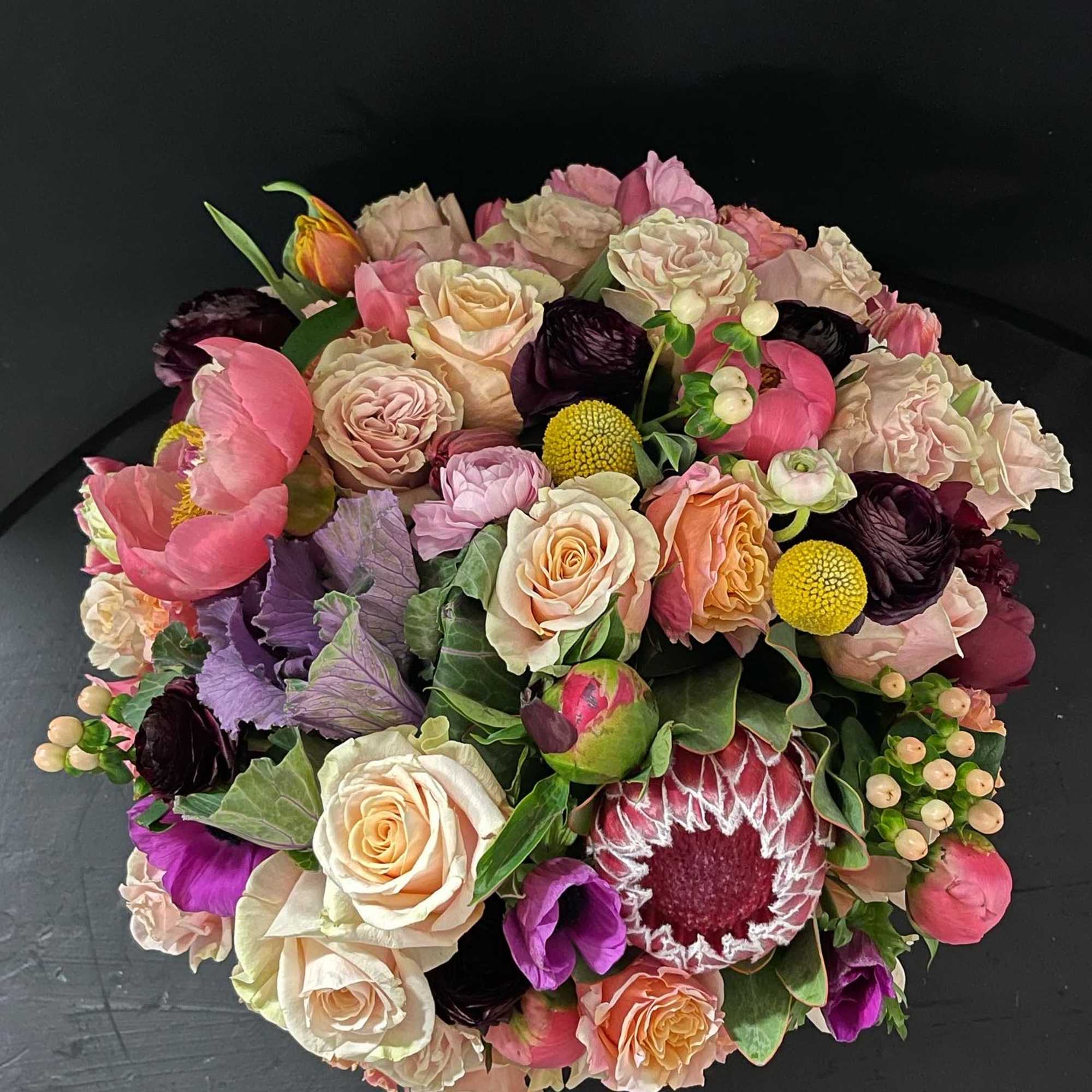 Garden style roses, scabiosa, ranunculus, proteas just to name a few. This