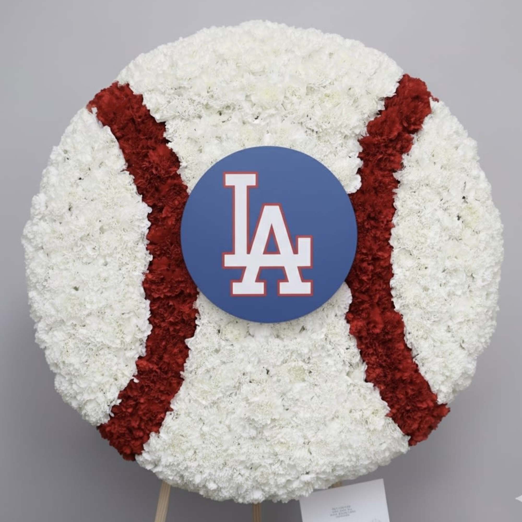 This full wreath contains custom flowers . The standard size is approximately