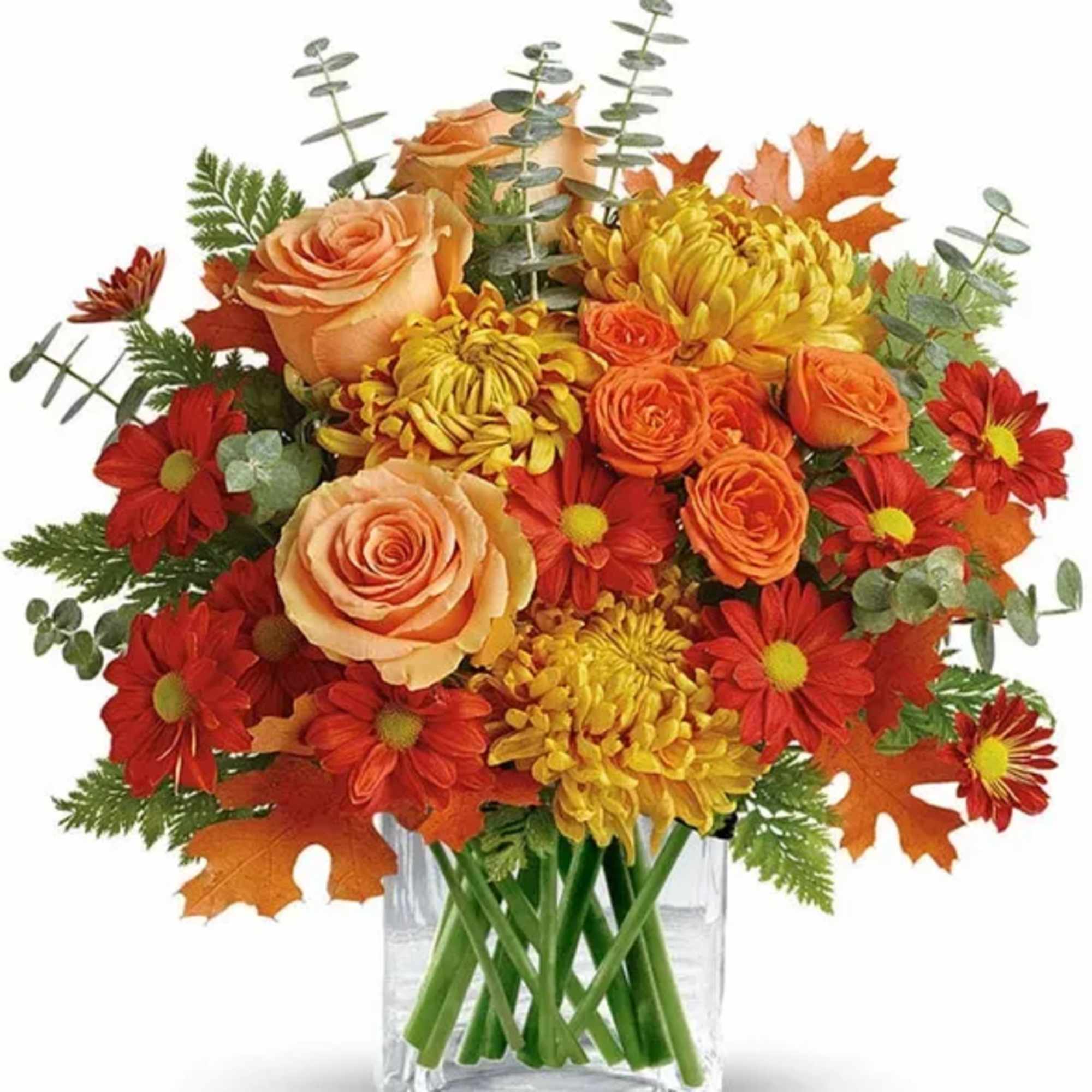 Beatiful fall arangment in a cube vase with some orange roses and