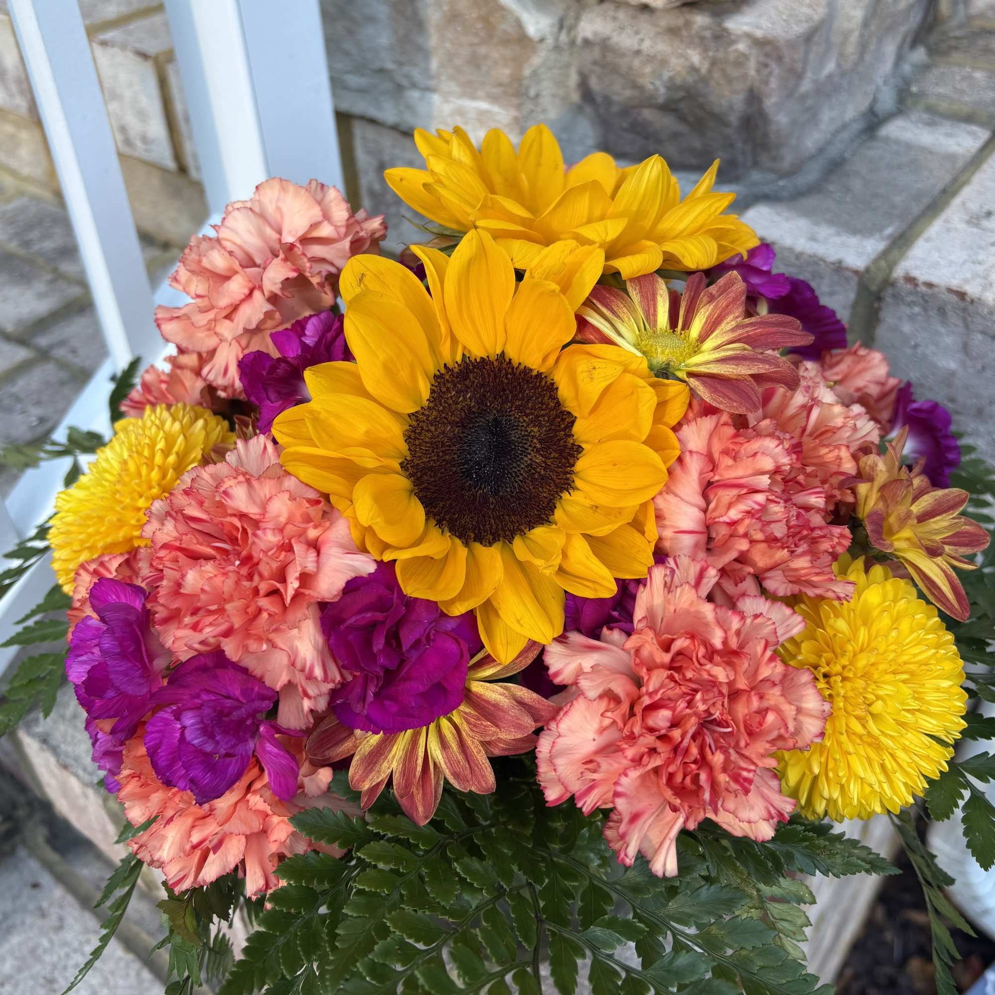 Bursting with the vibrant colors of the season, the Starburst arrangement brings