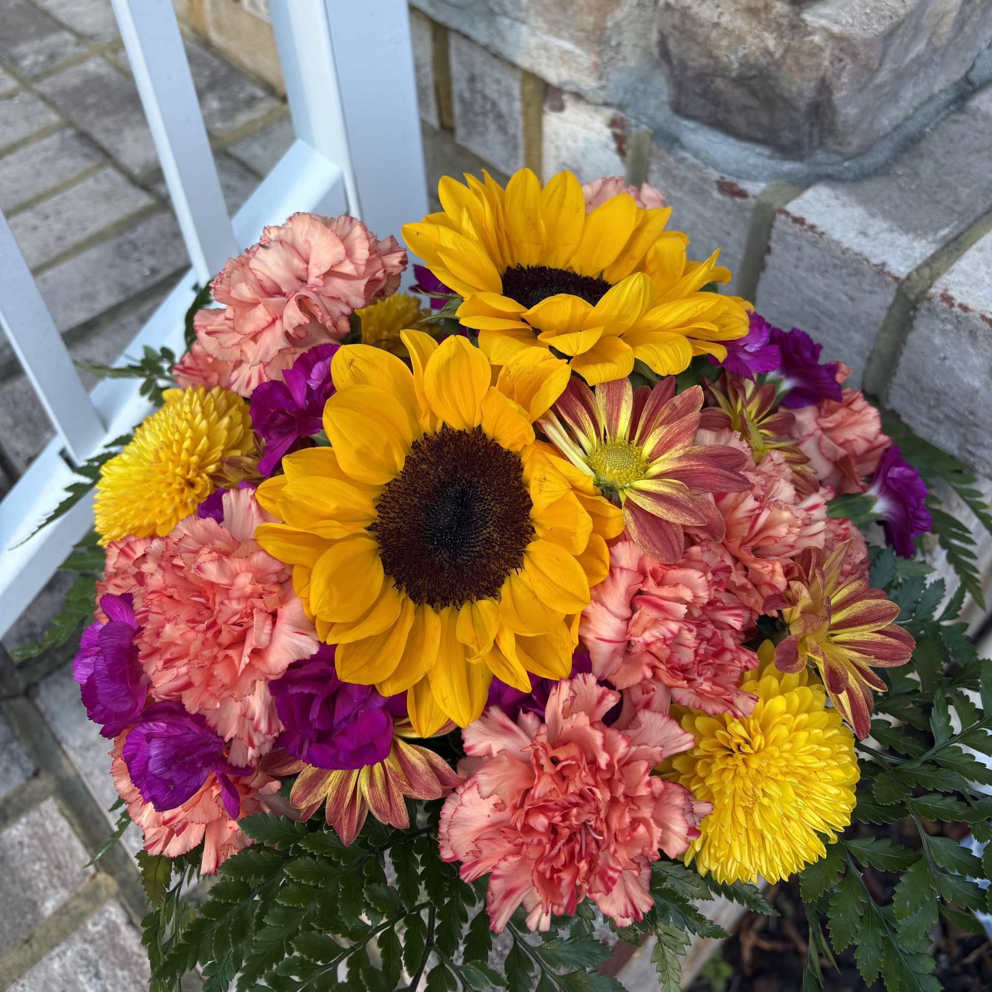 Bursting with the vibrant colors of the season, the Starburst arrangement brings